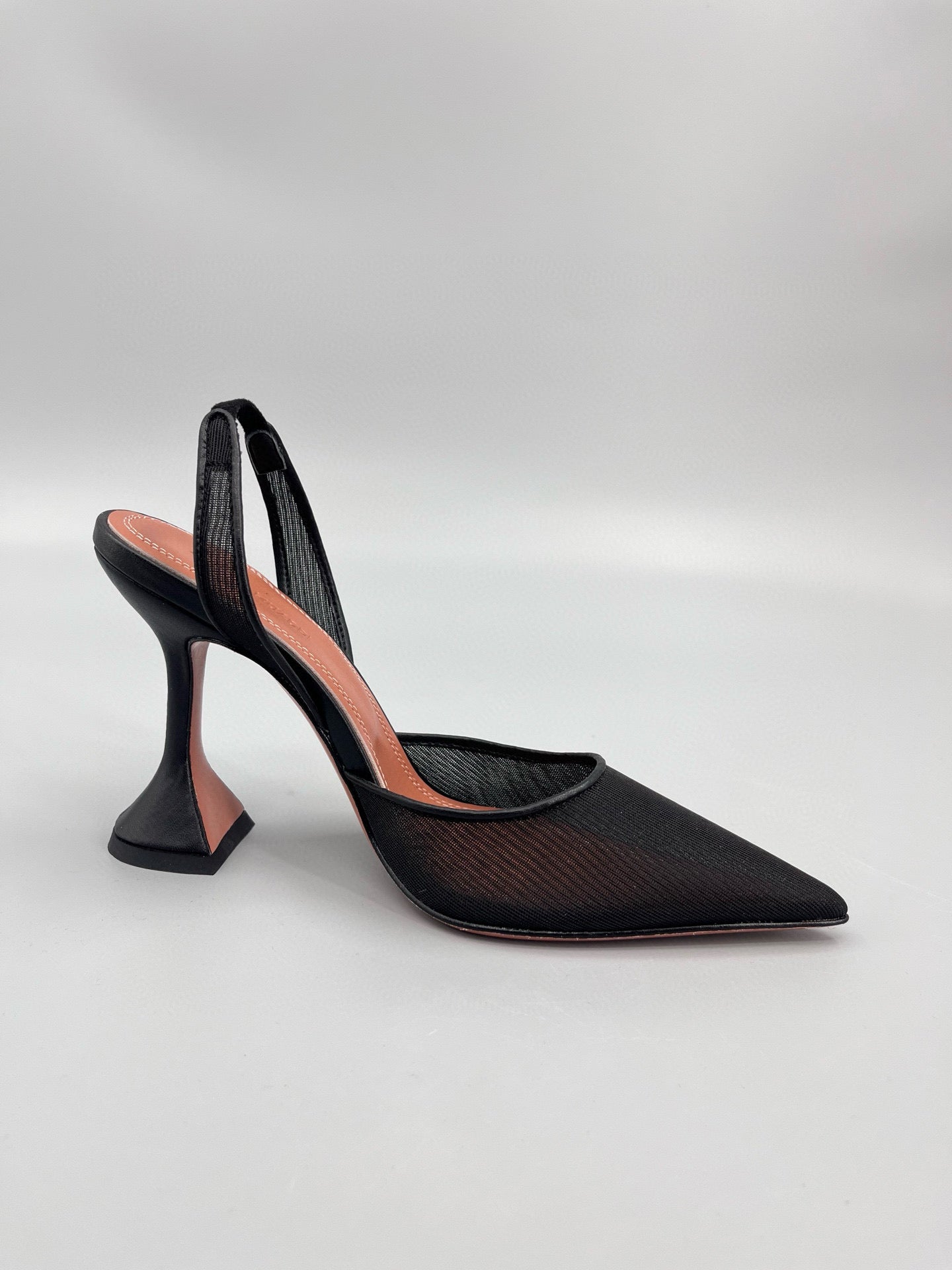 AMINA M HEELS