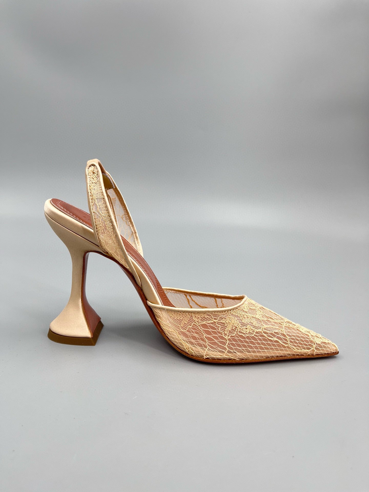 AMINA M HEELS