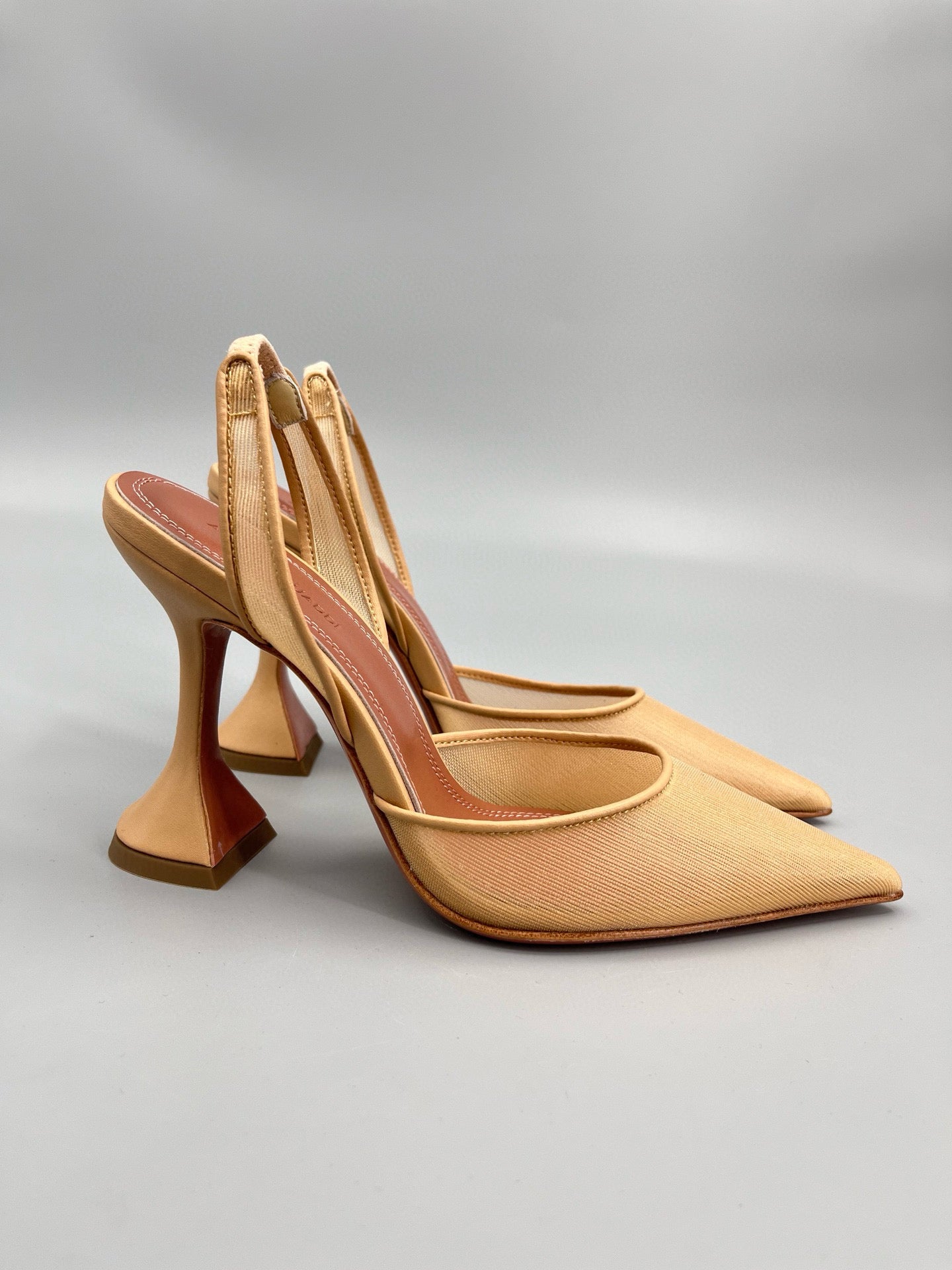 AMINA M HEELS