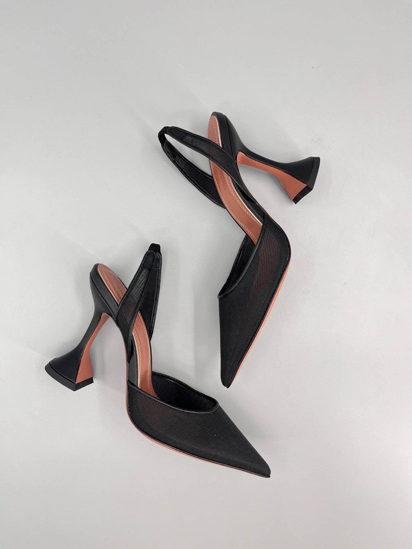 AMINA M HEELS