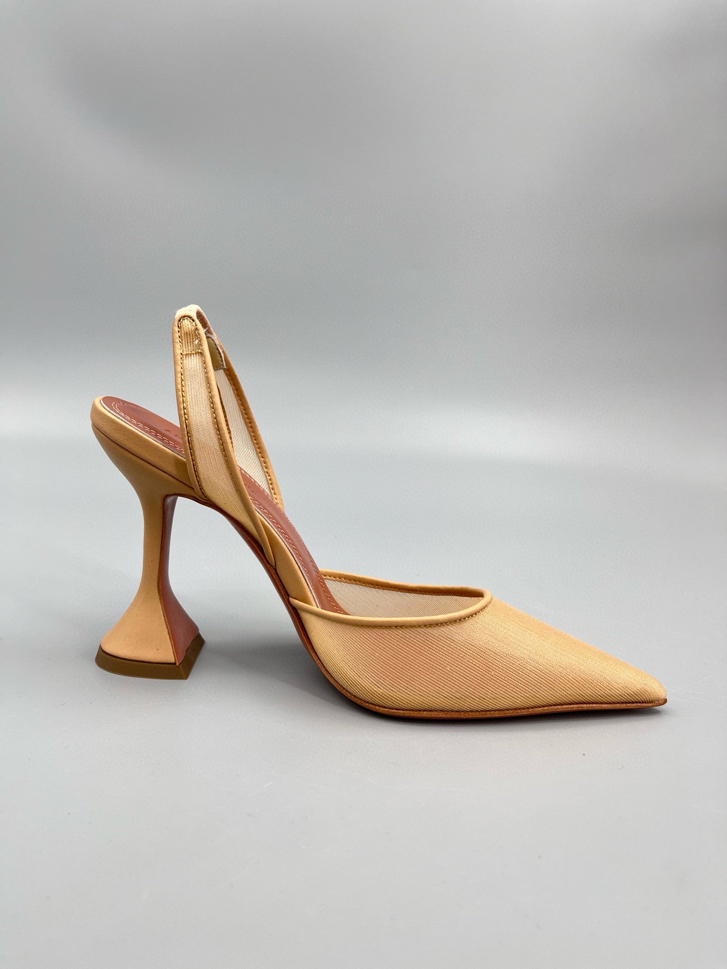 AMINA M HEELS