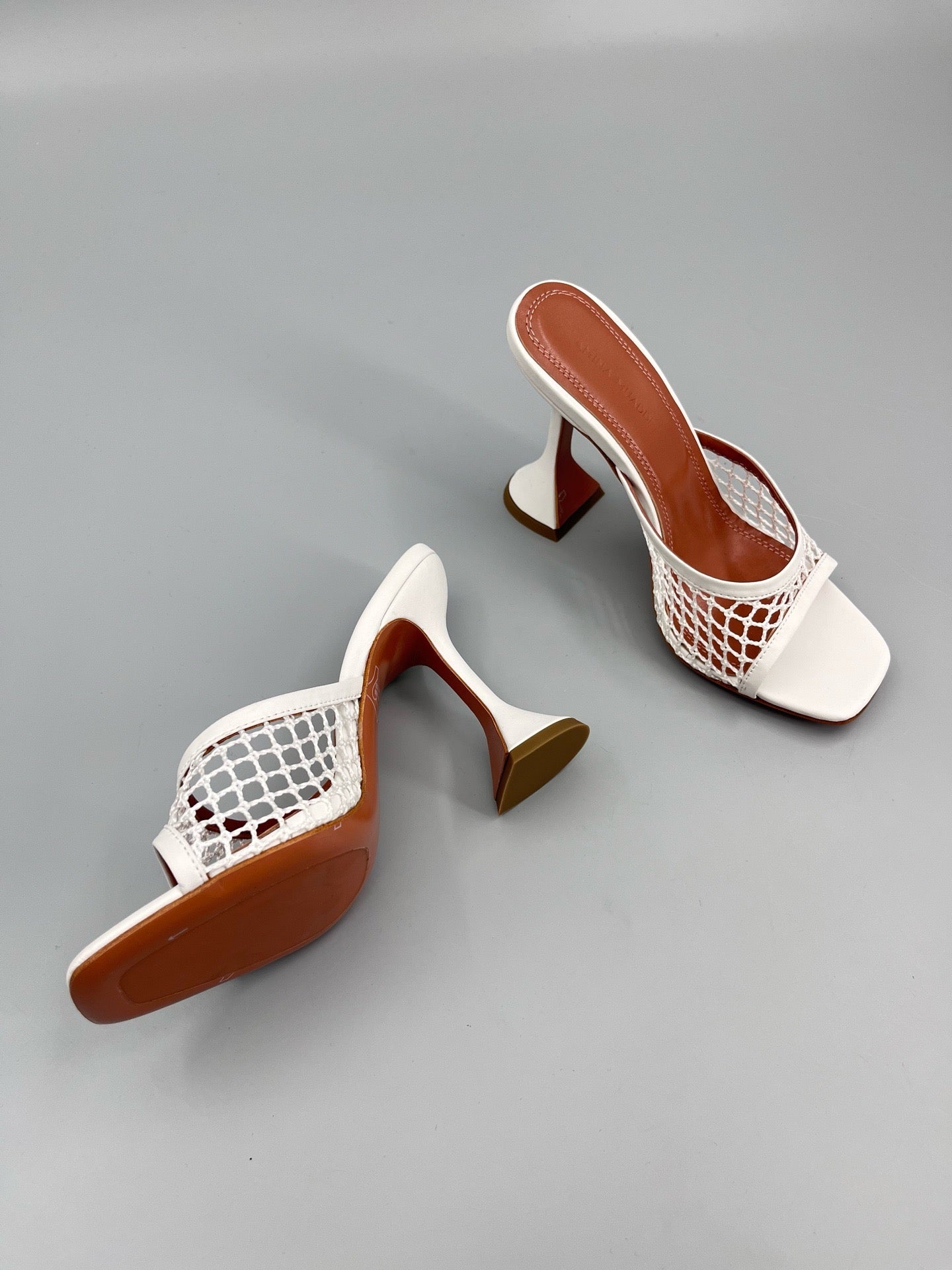 AMINA M HEELS