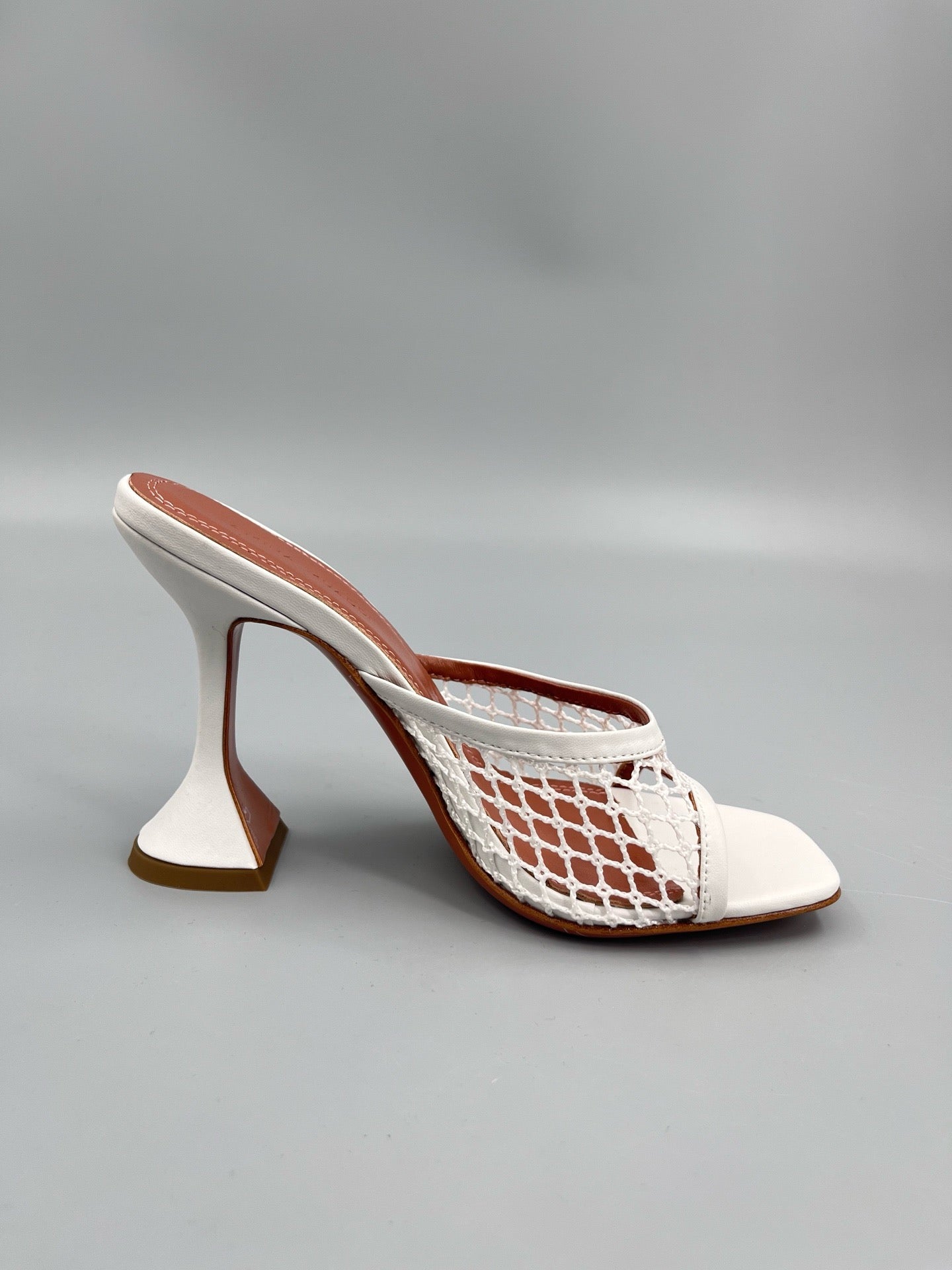 AMINA M HEELS