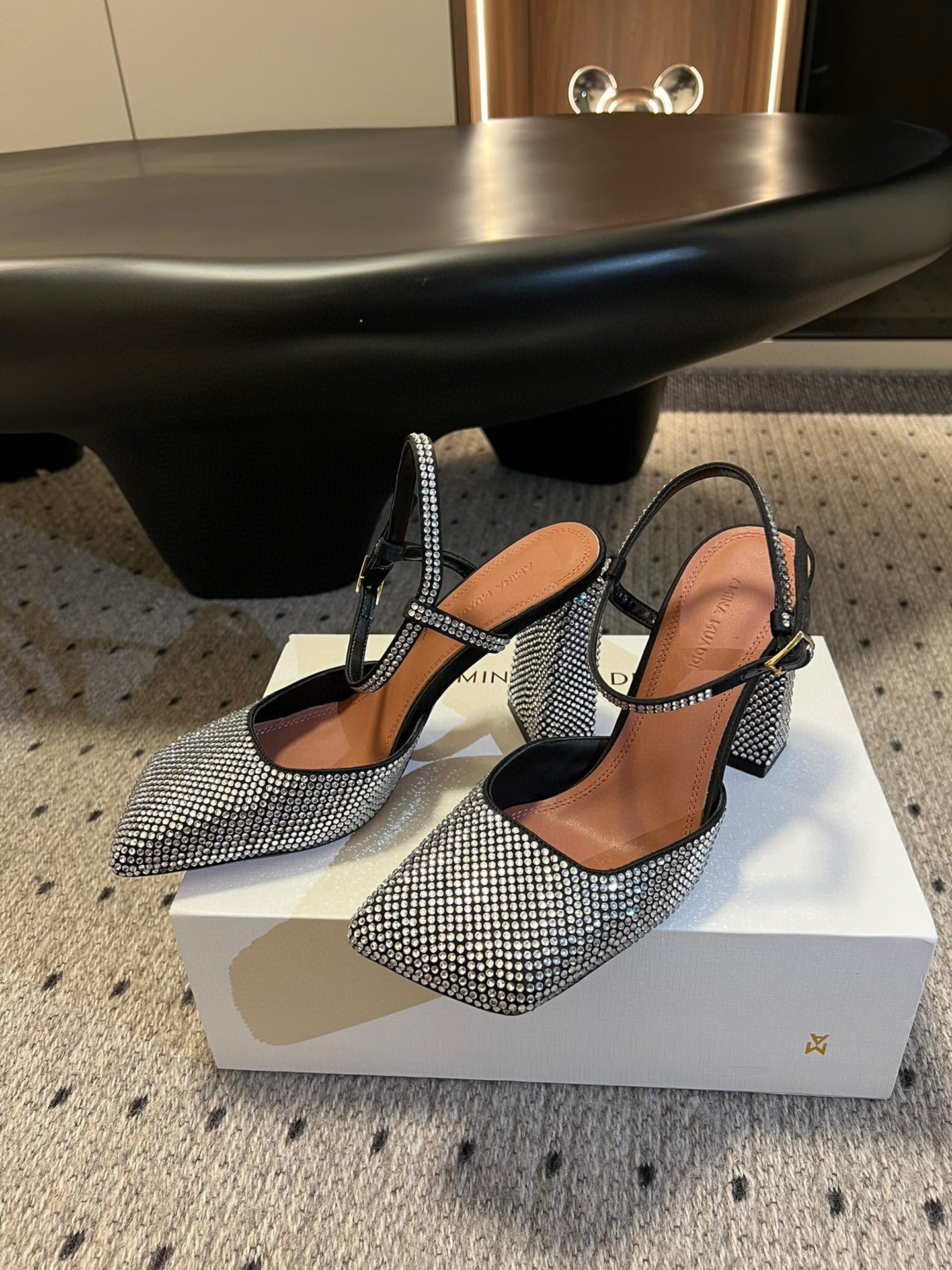 AMINA M HEELS