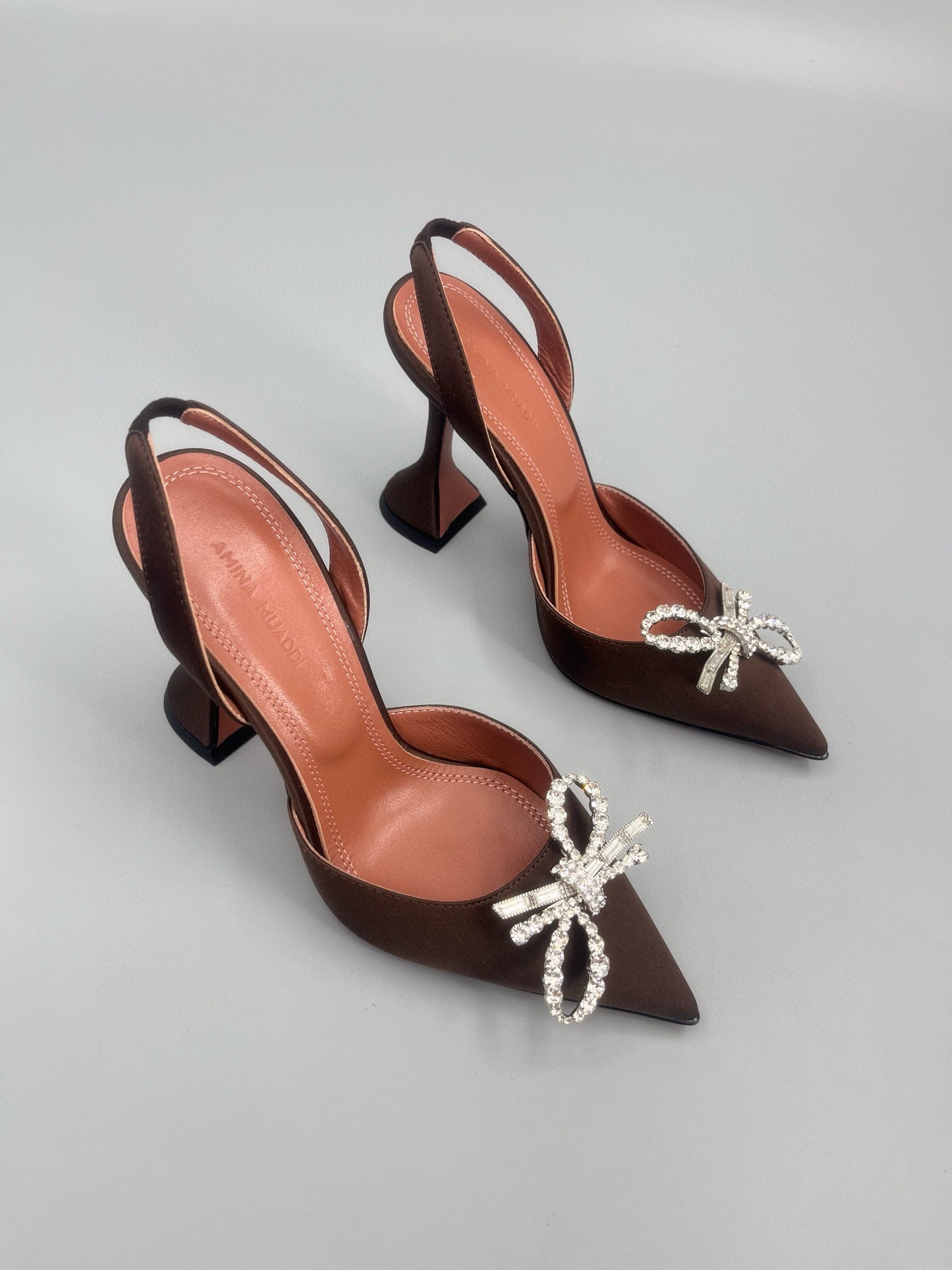 AMINA M HEELS