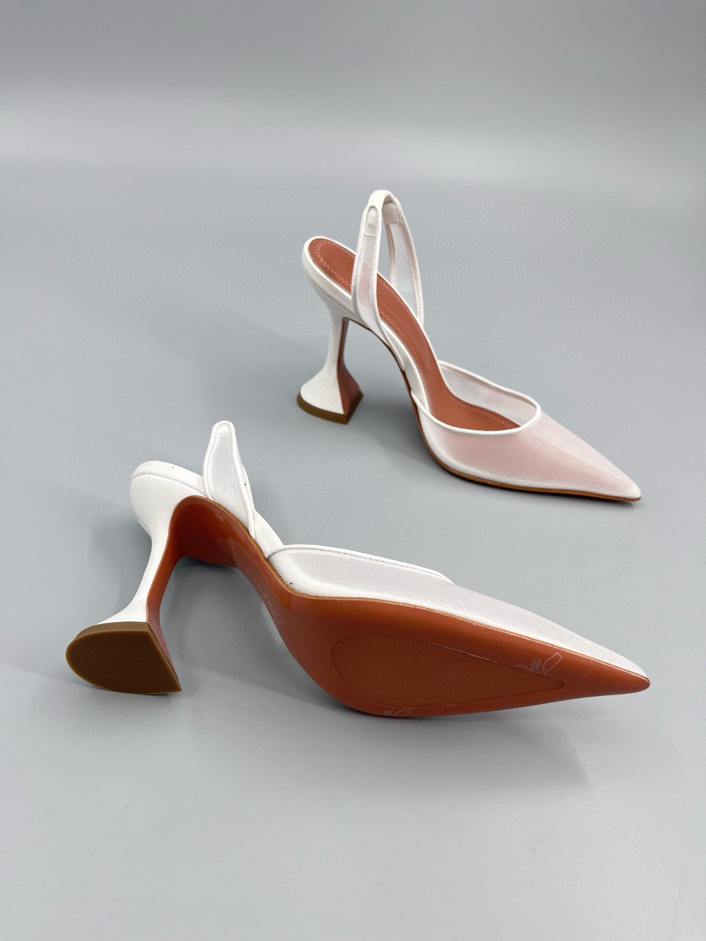AMINA M HEELS
