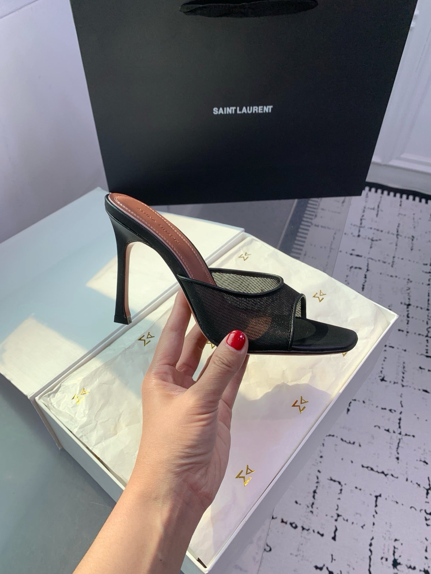 AMINA M HEELS