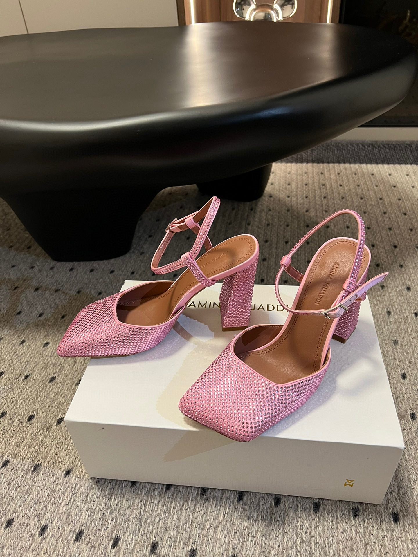 AMINA M HEELS