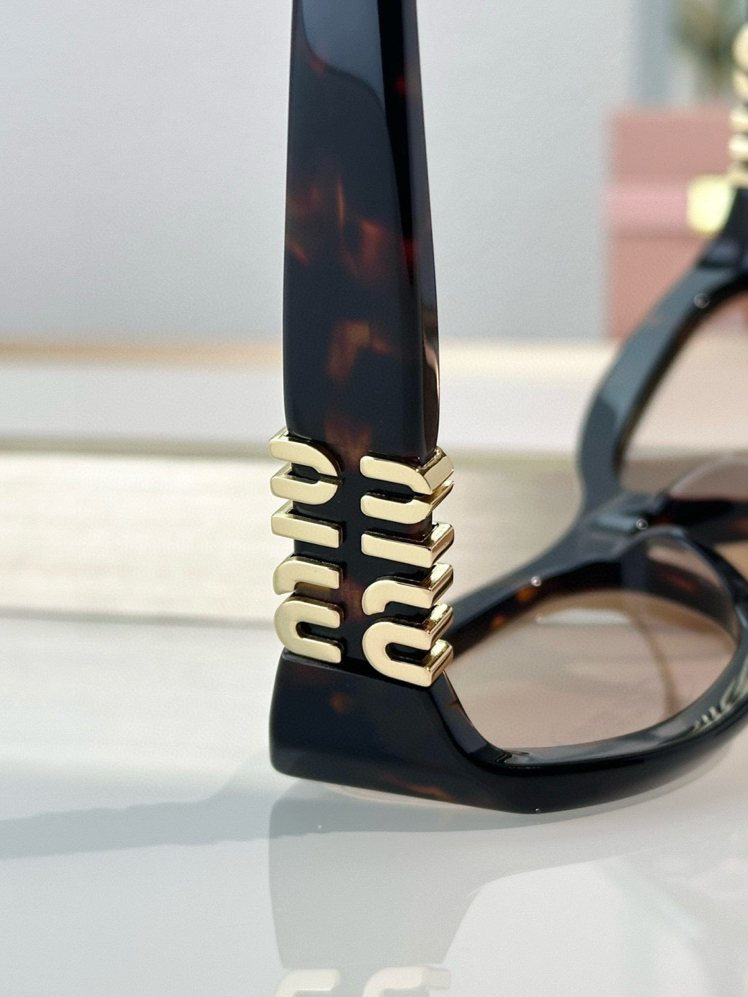 MIU M SUNGLASSES