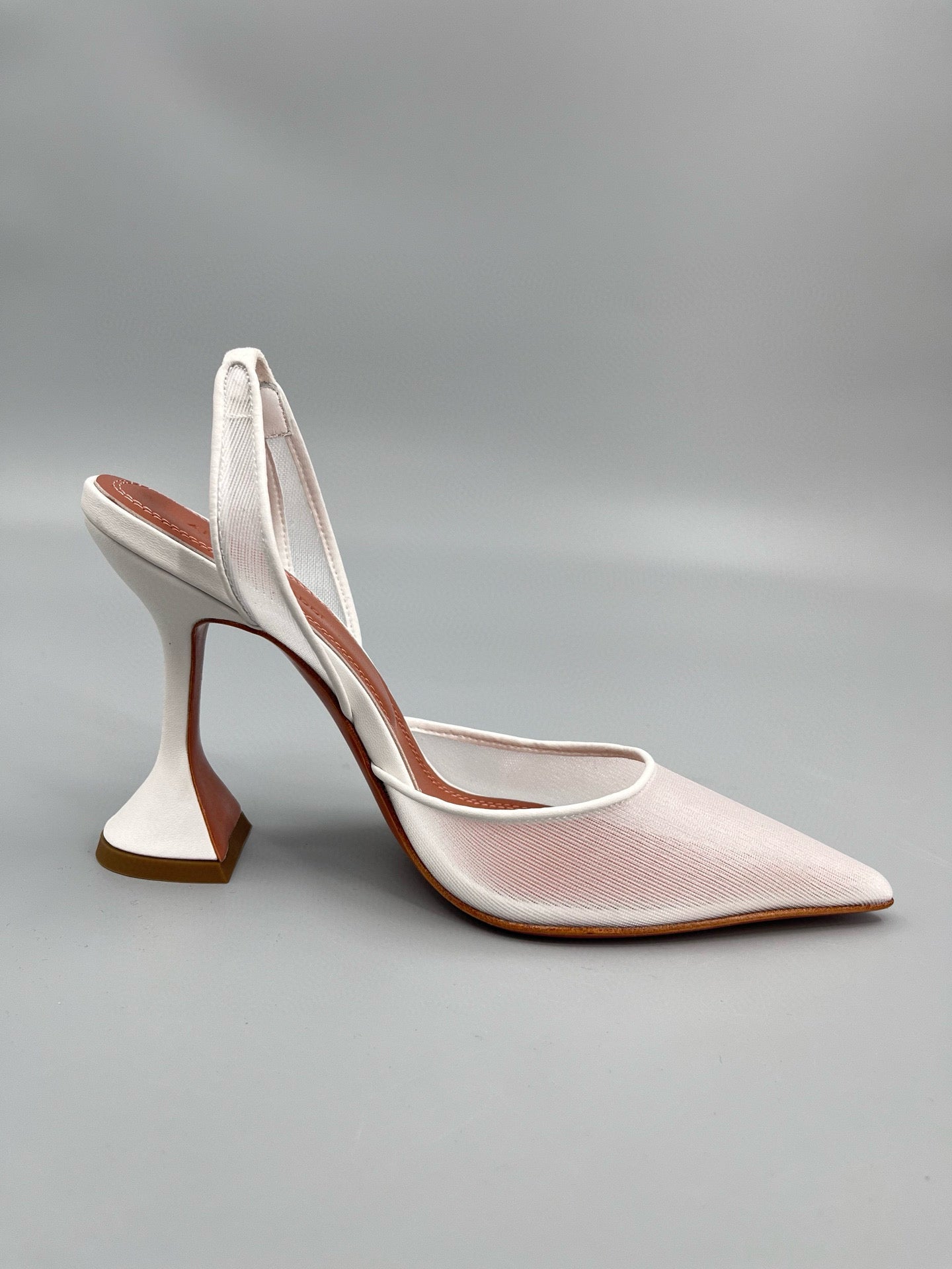 AMINA M HEELS