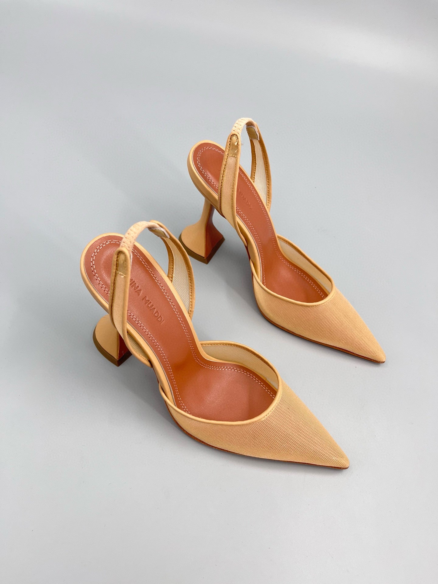 AMINA M HEELS