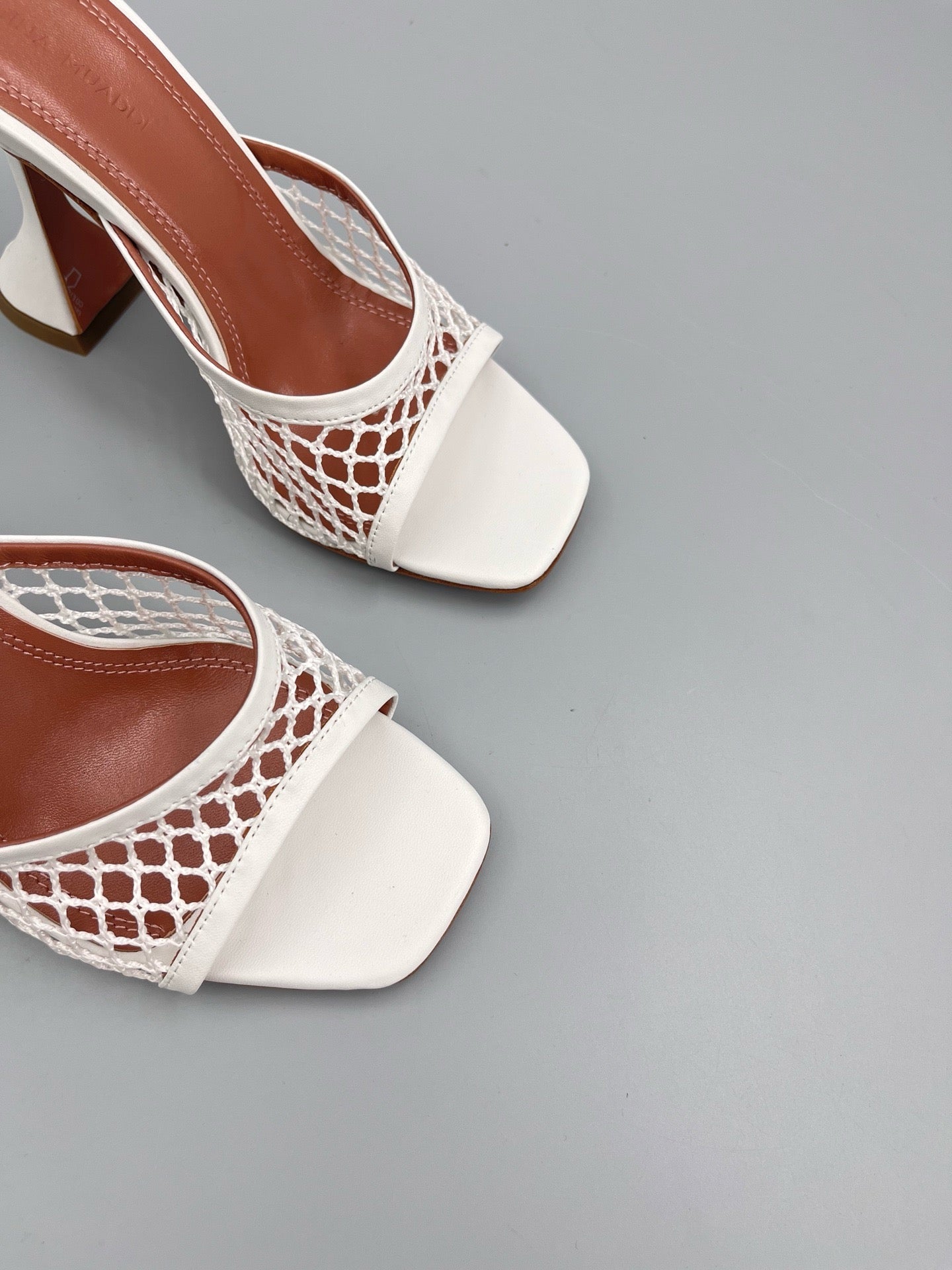AMINA M HEELS