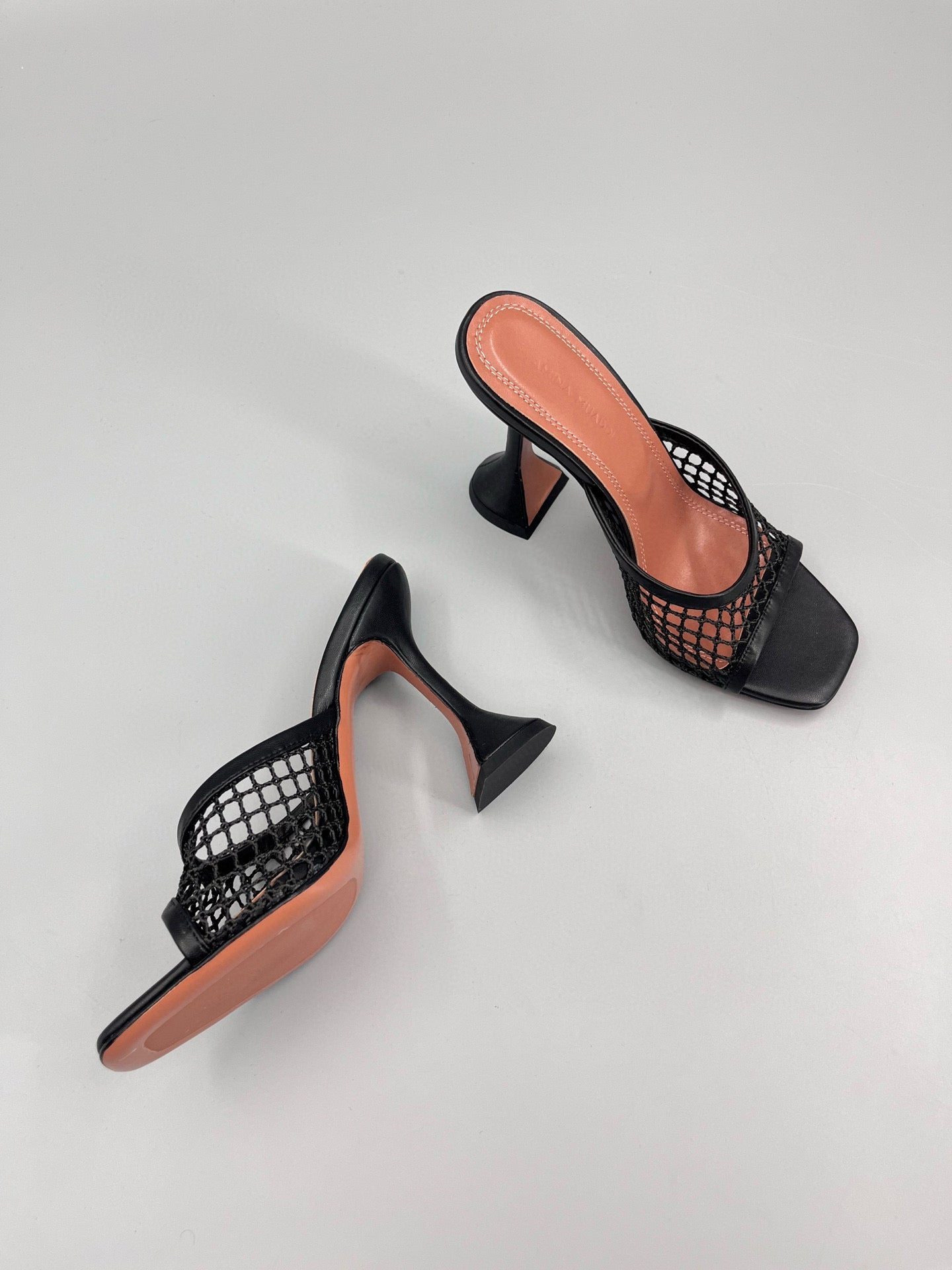 AMINA M HEELS