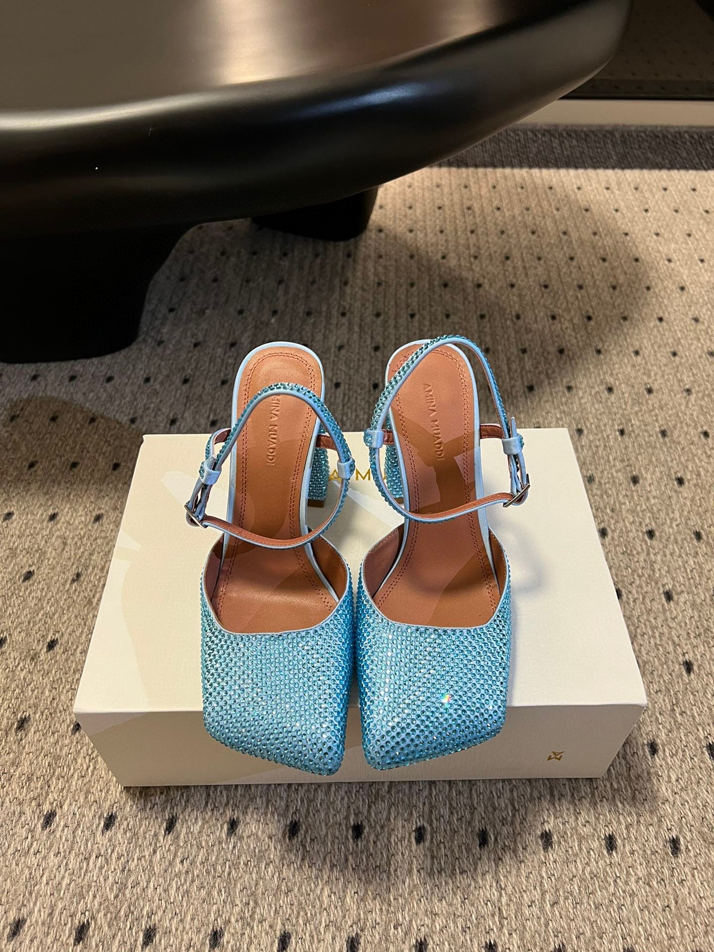 AMINA M HEELS