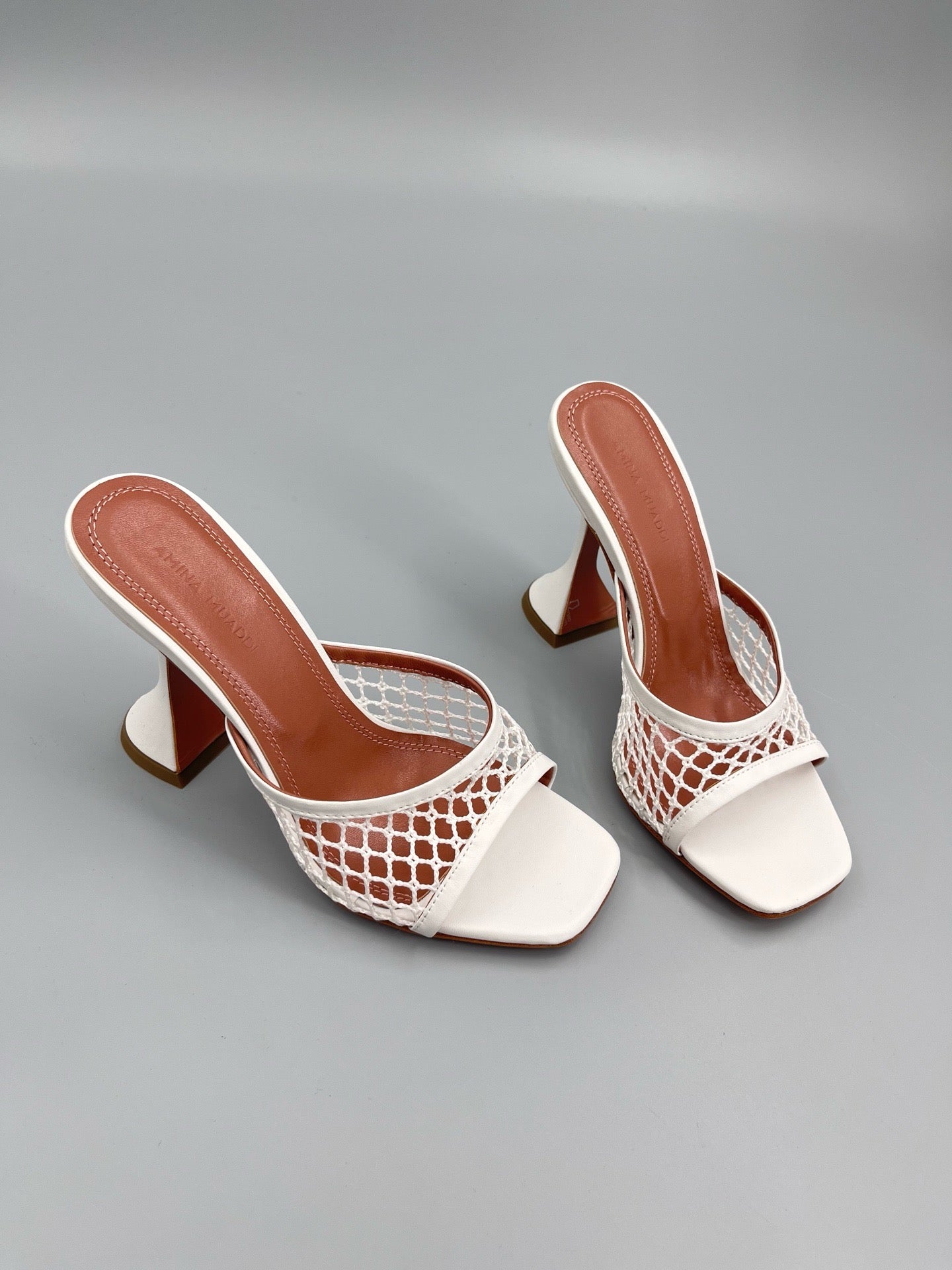 AMINA M HEELS