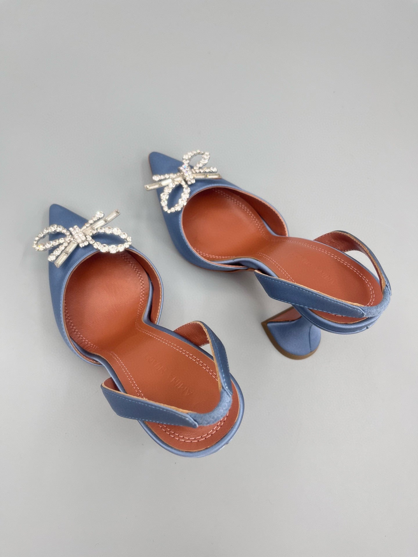 AMINA M HEELS