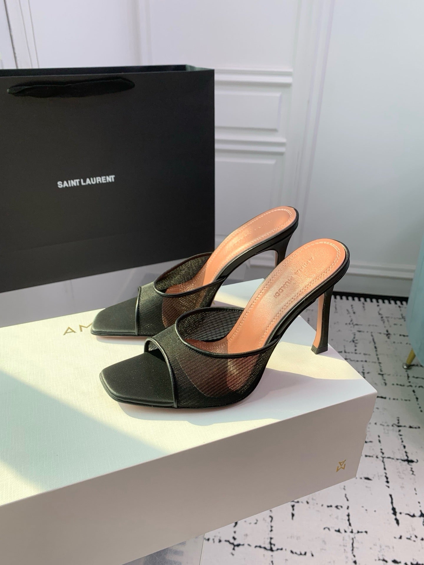 AMINA M HEELS
