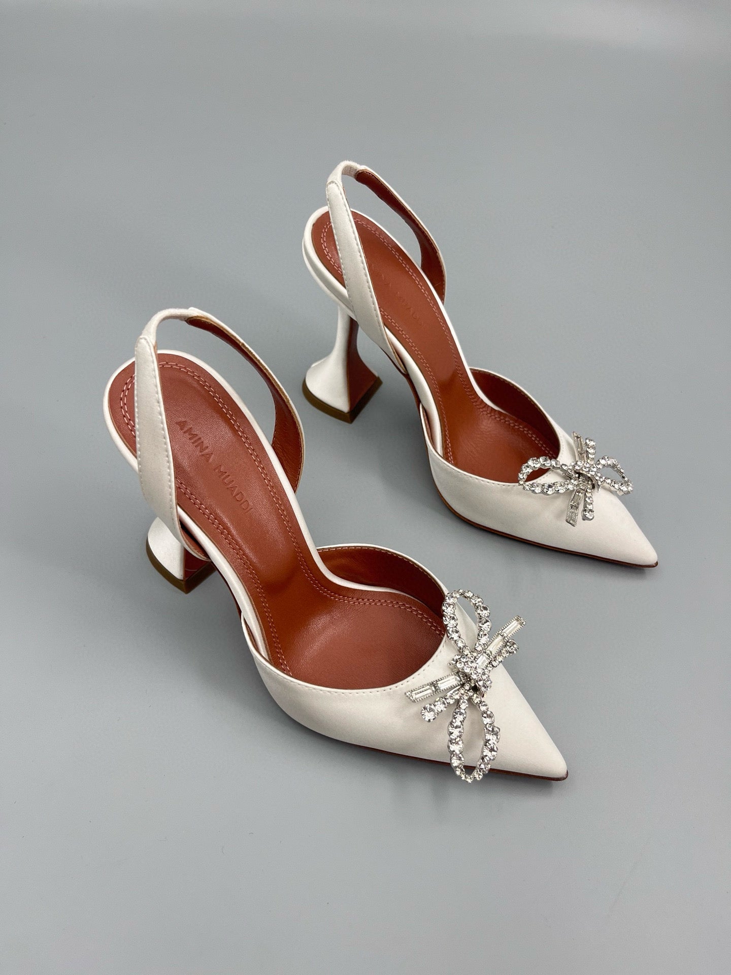AMINA M HEELS