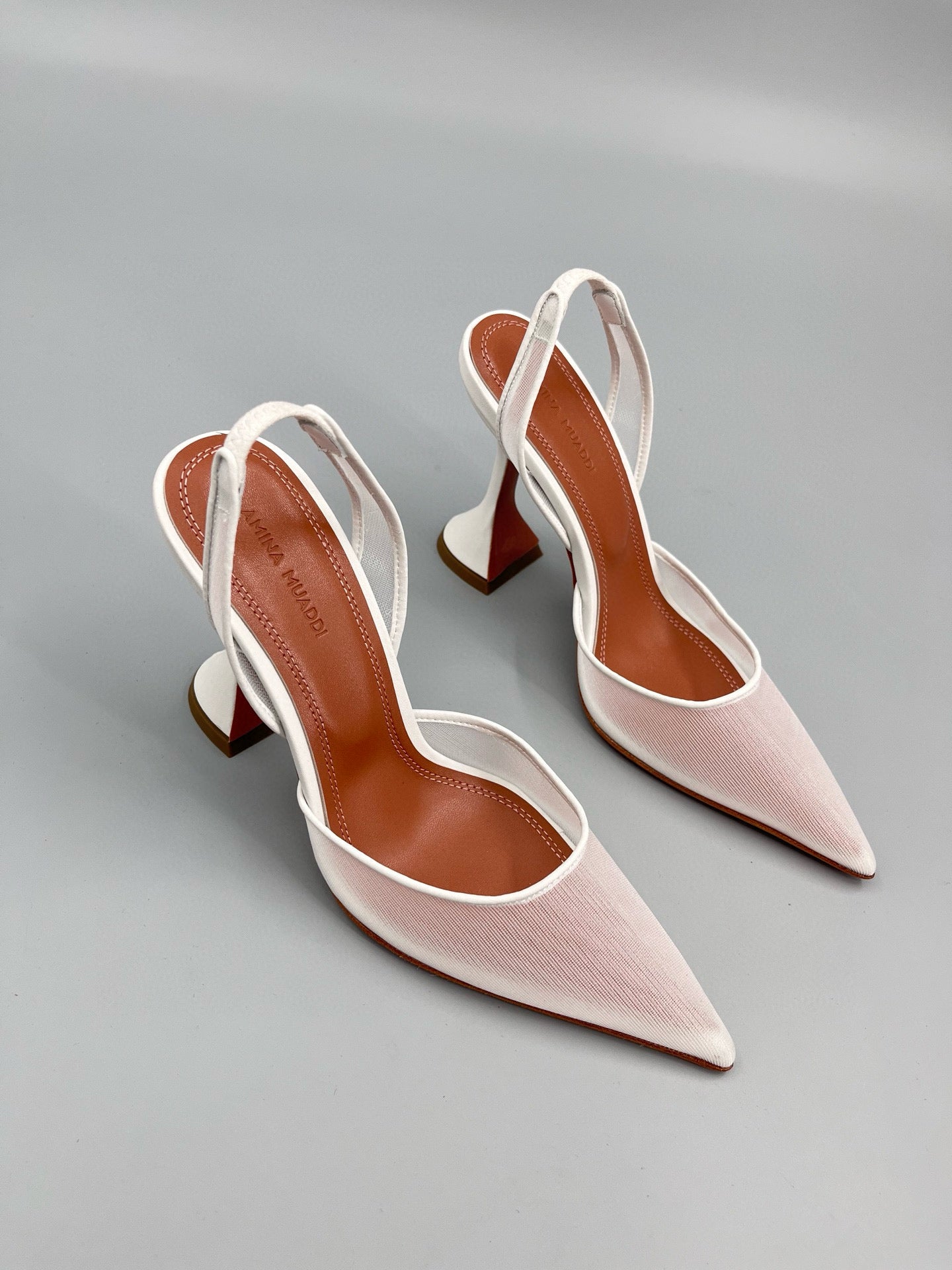 AMINA M HEELS