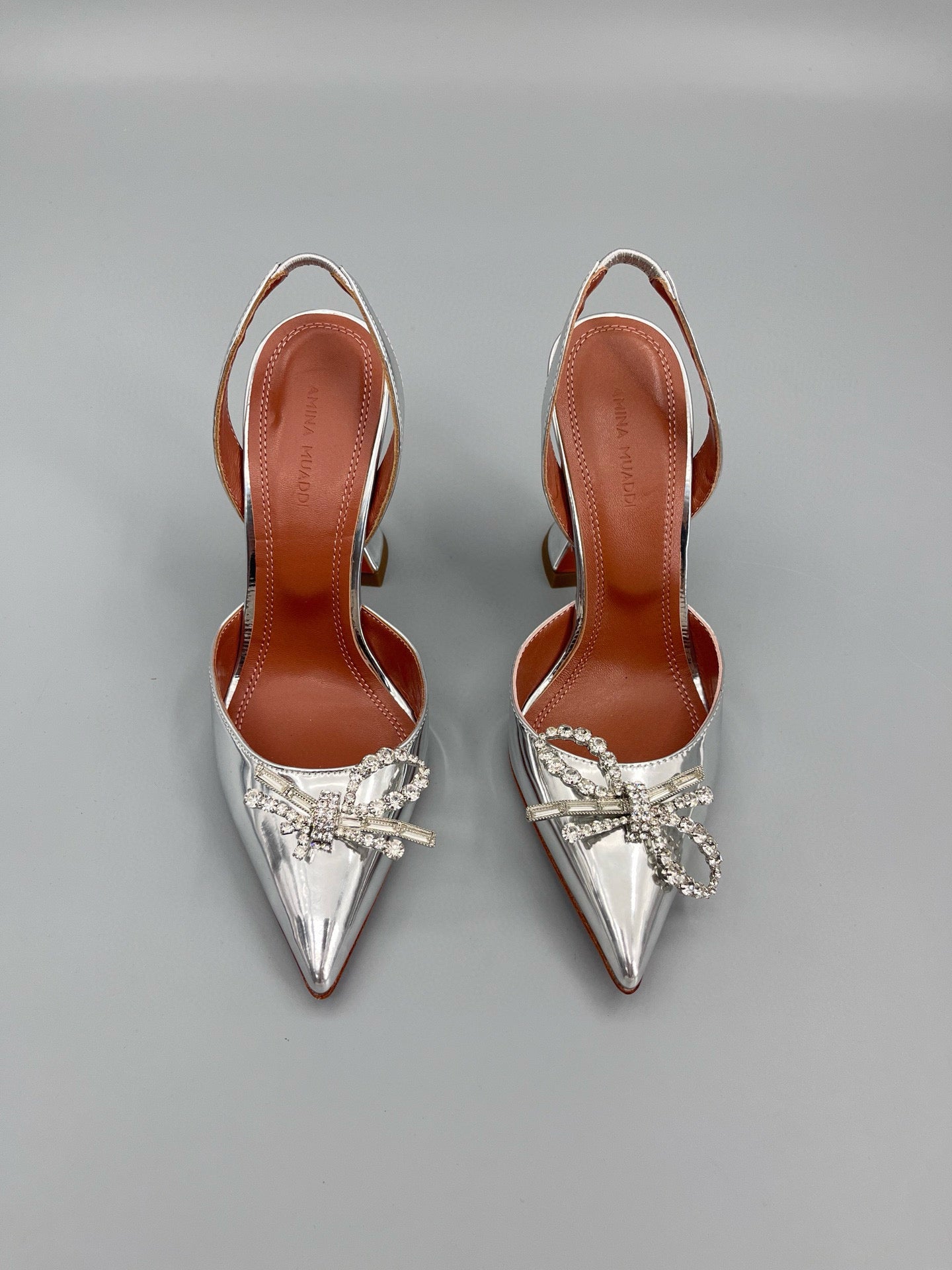 AMINA M HEELS