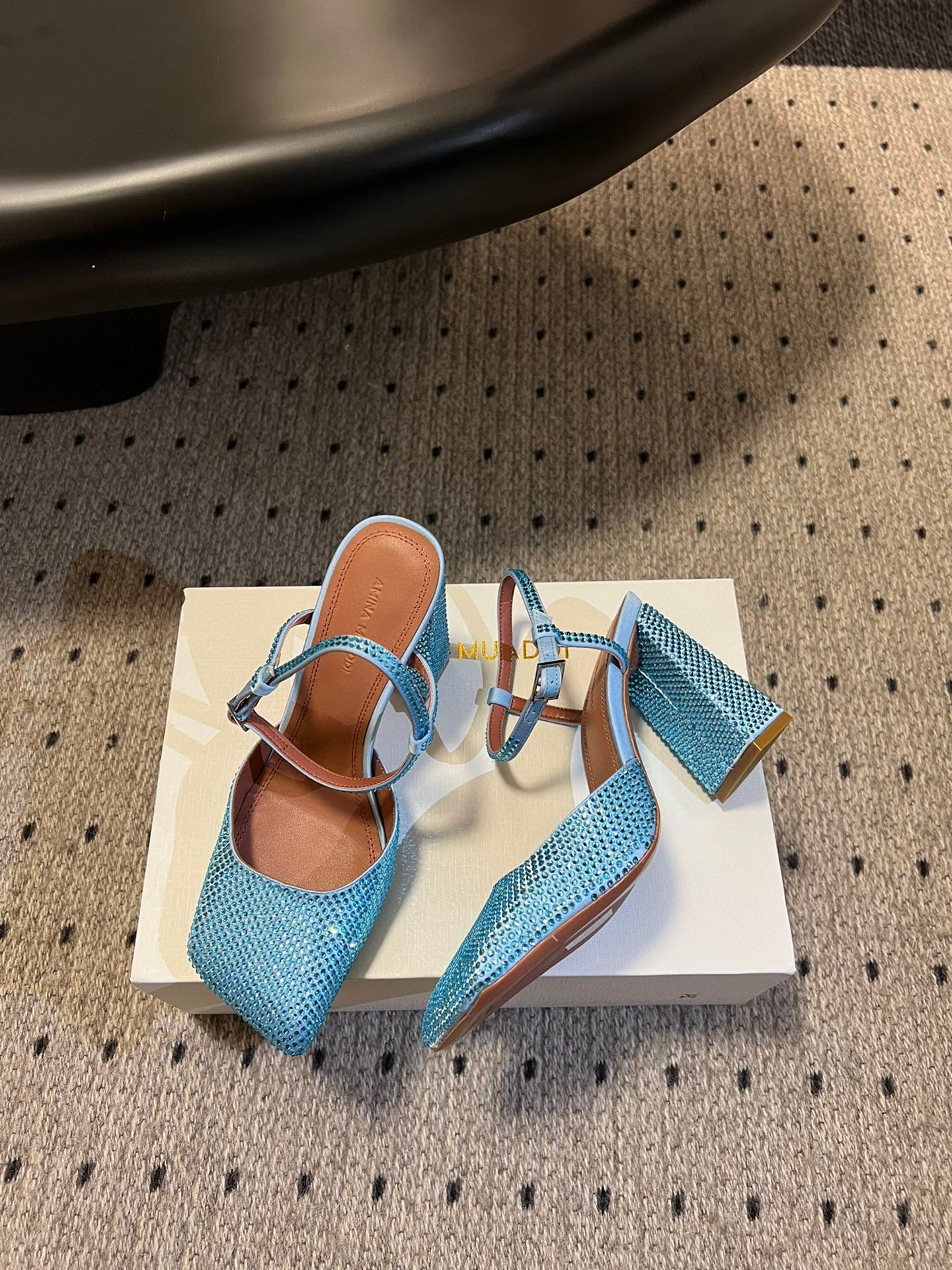 AMINA M HEELS