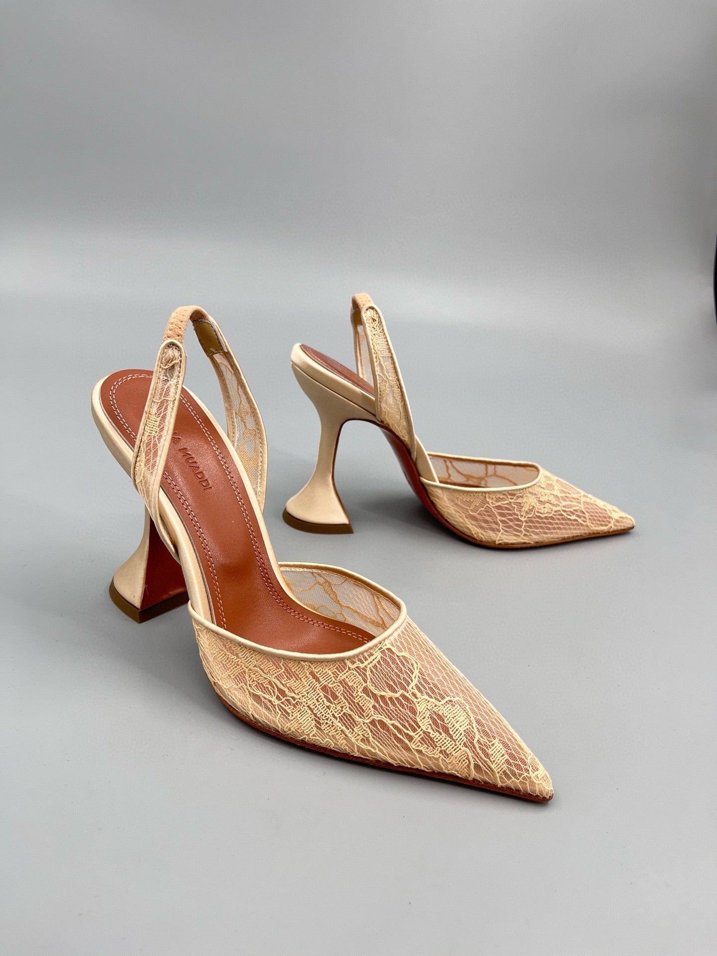 AMINA M HEELS