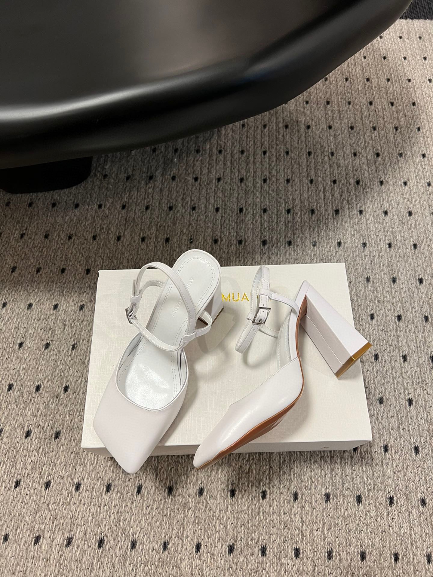 AMINA M HEELS