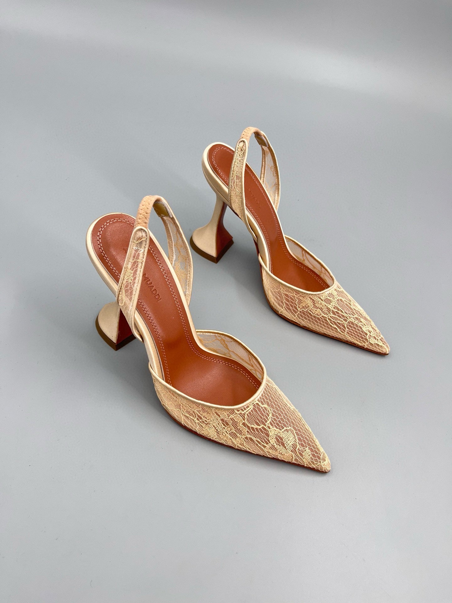 AMINA M HEELS