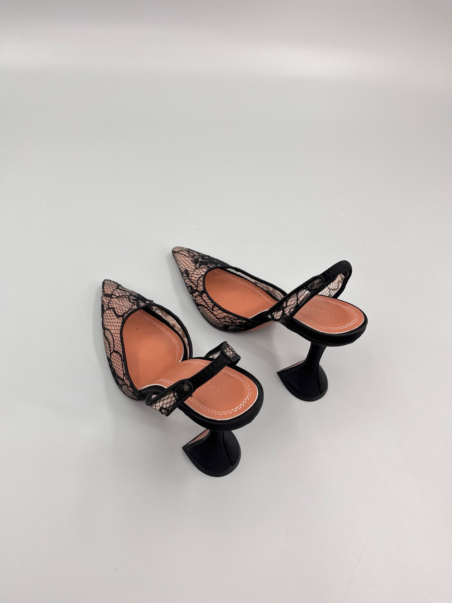 AMINA M HEELS