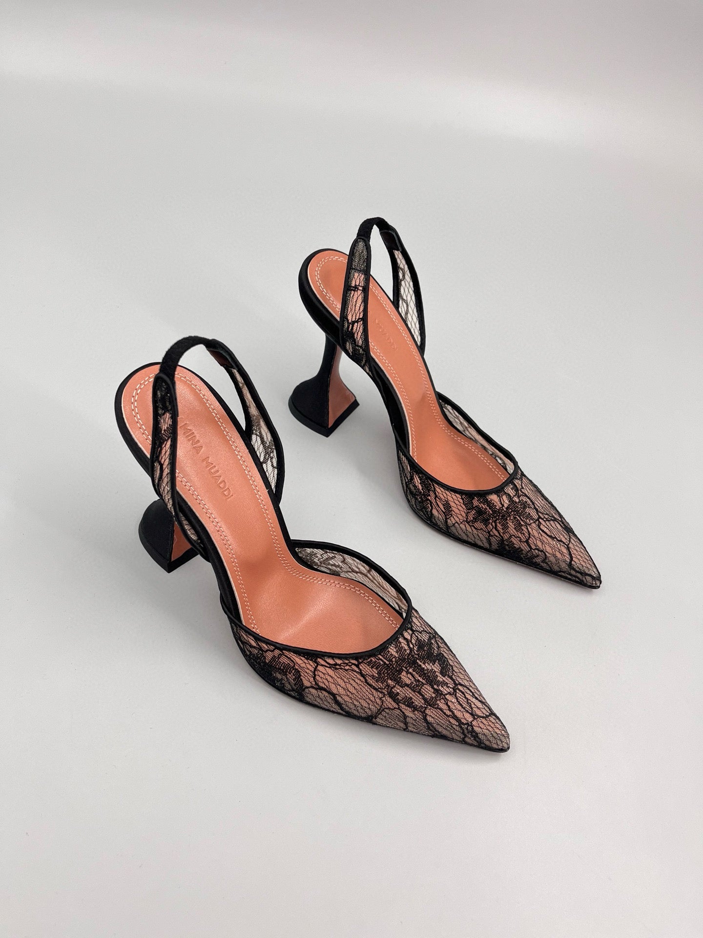 AMINA M HEELS