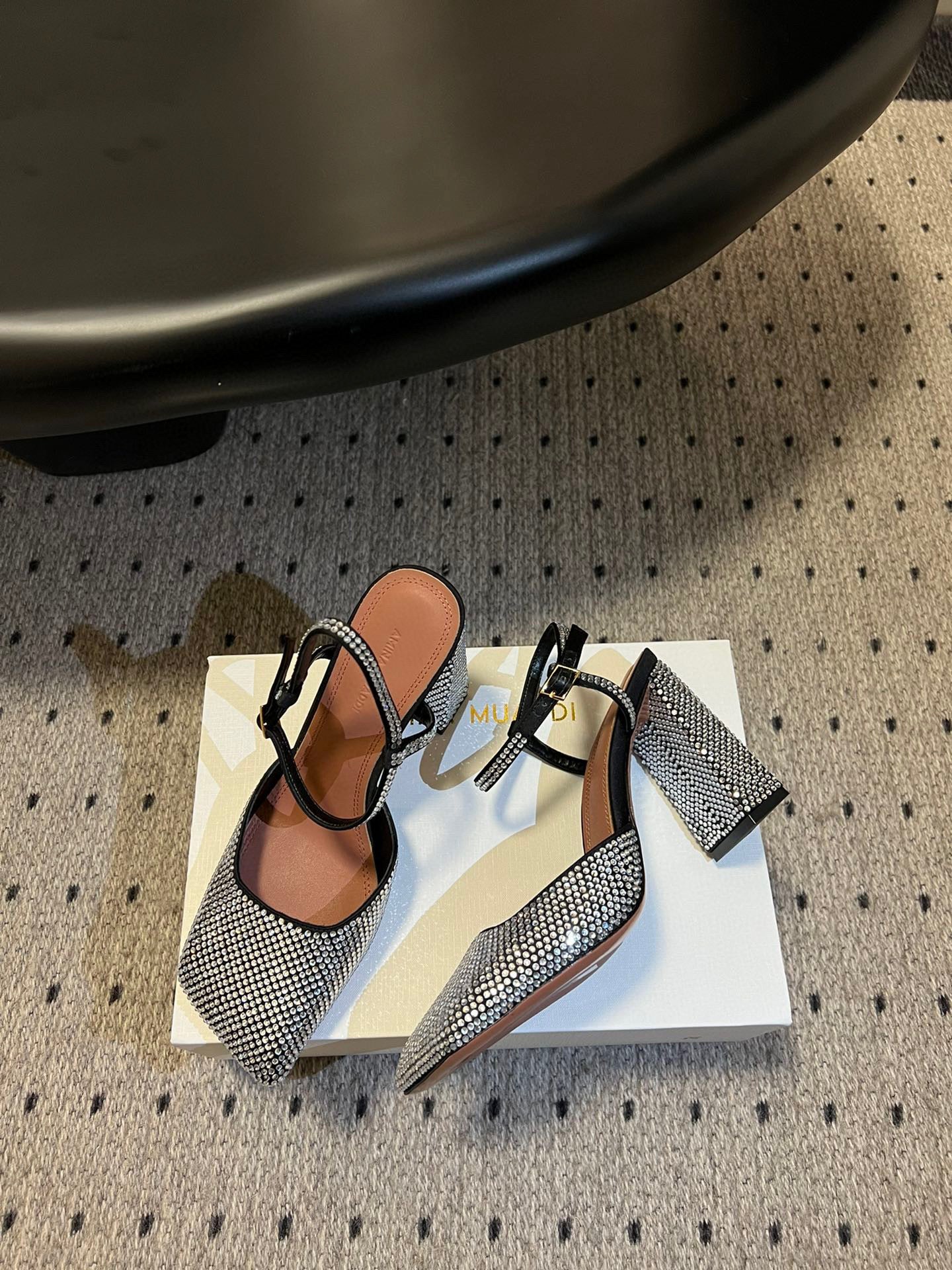 AMINA M HEELS