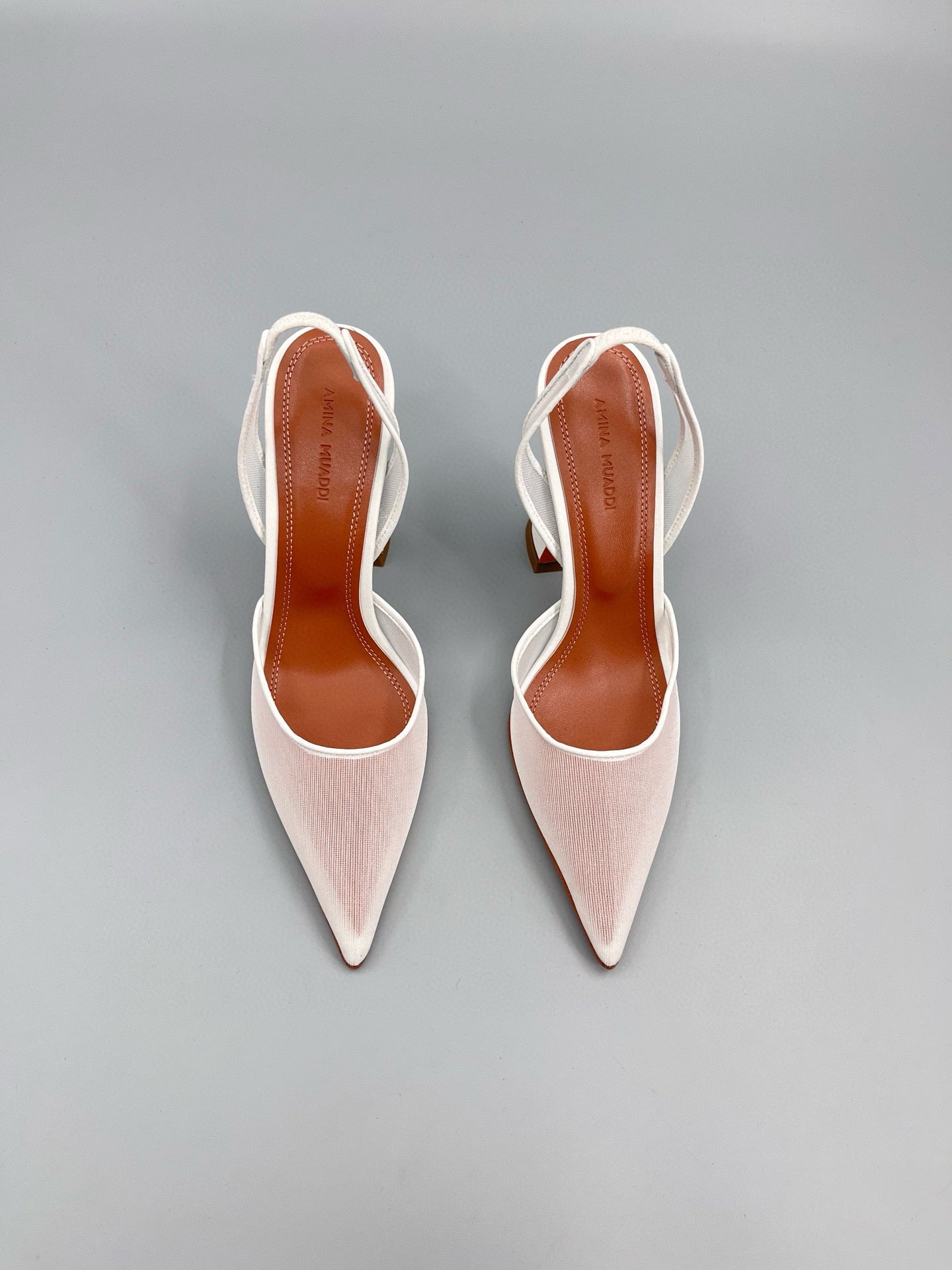 AMINA M HEELS