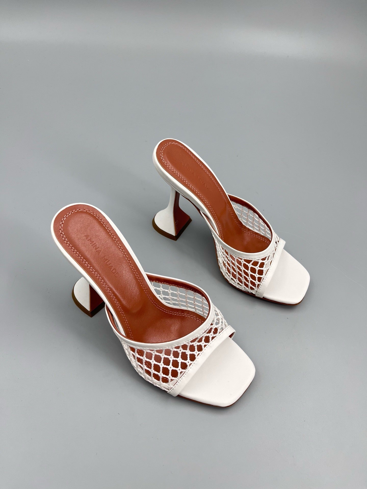 AMINA M HEELS