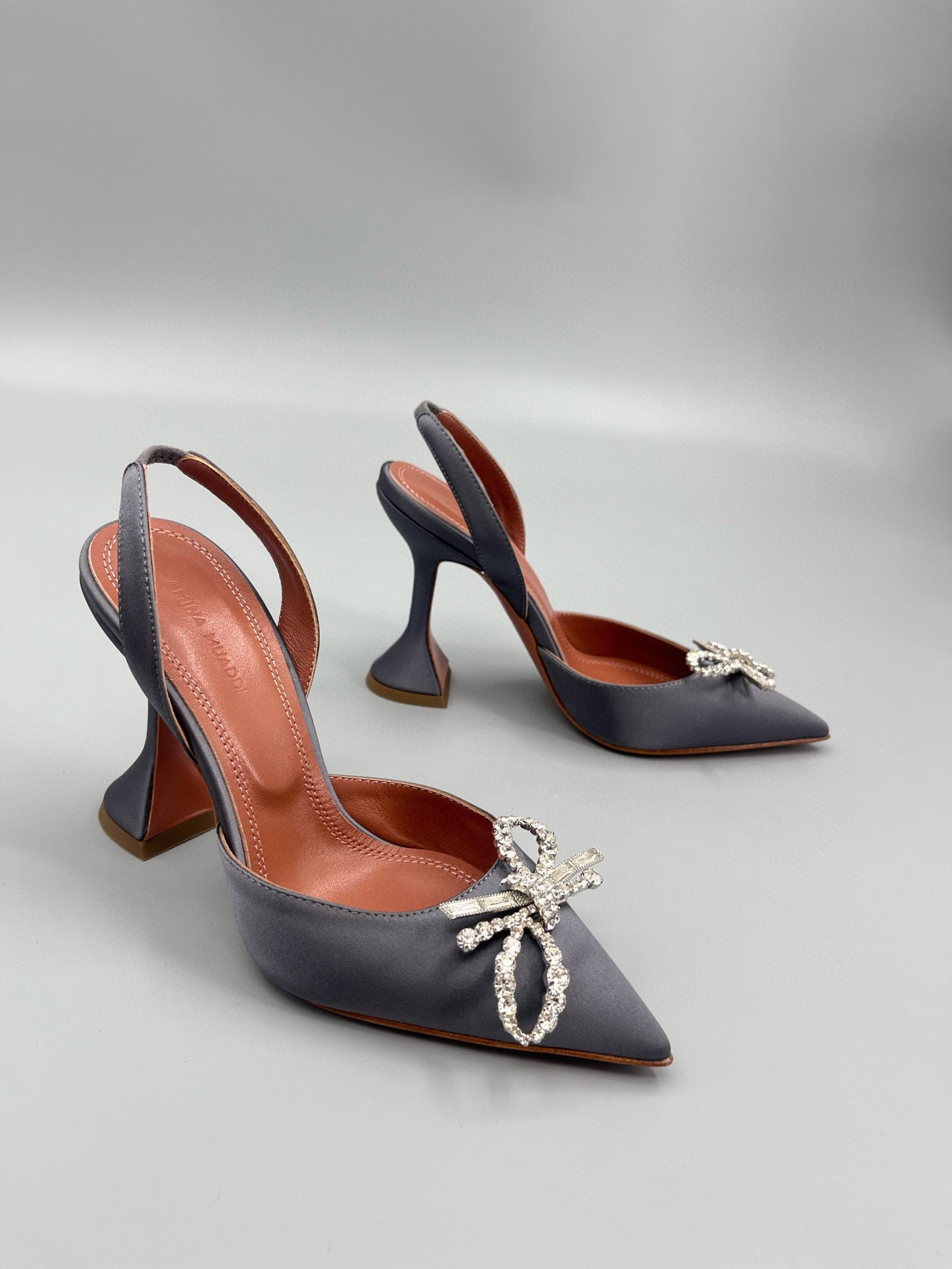 AMINA M HEELS