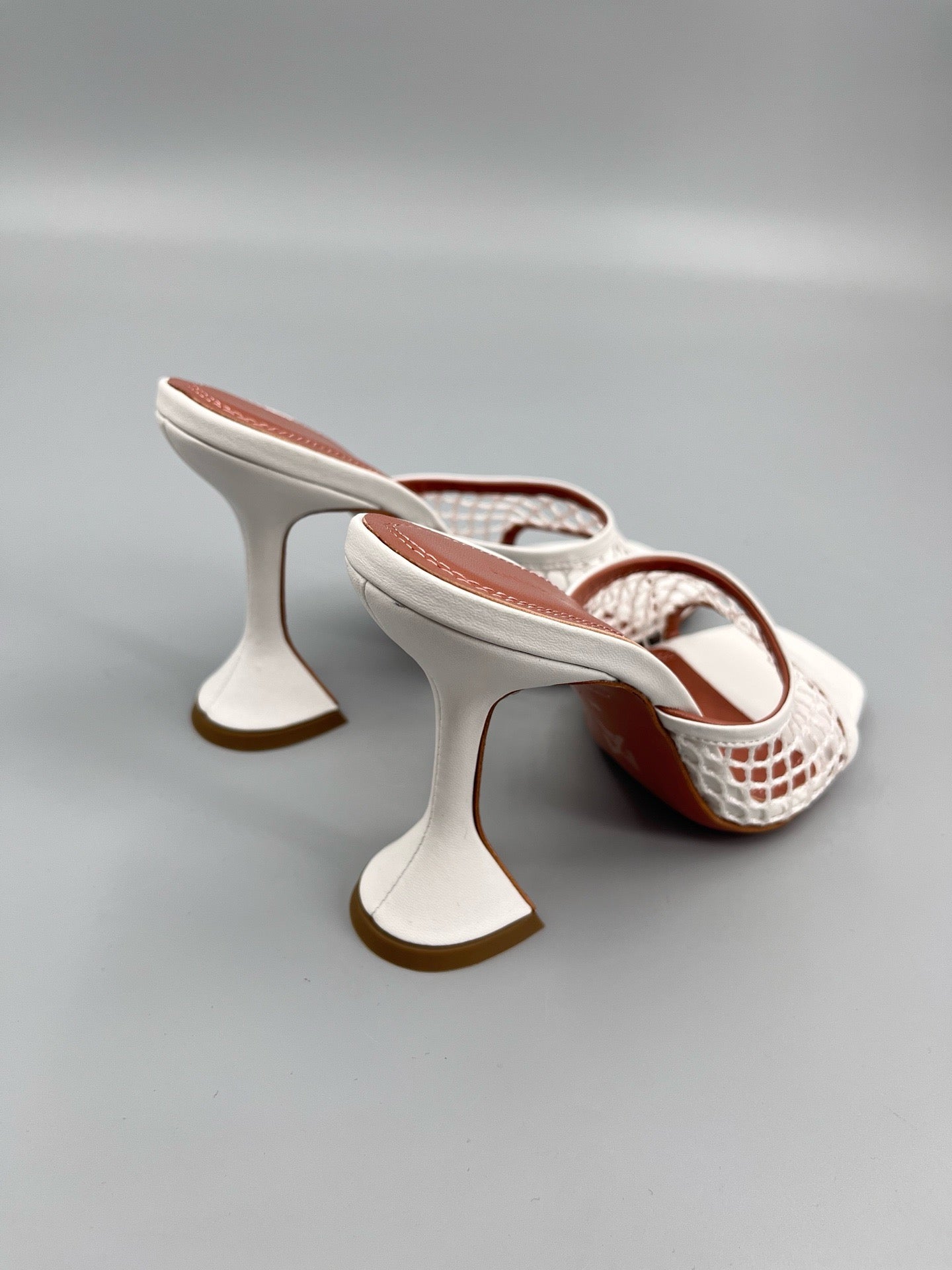 AMINA M HEELS