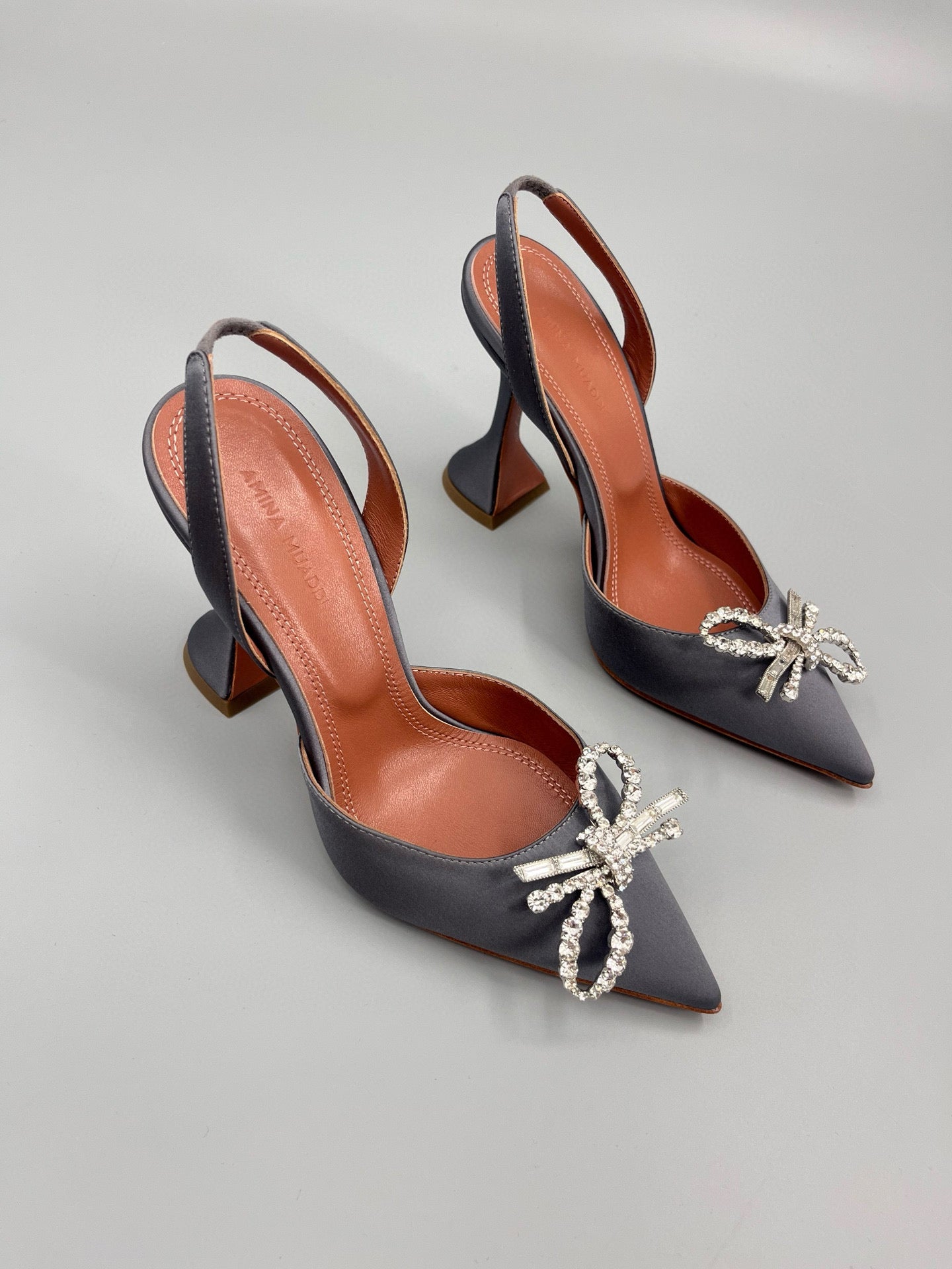 AMINA M HEELS