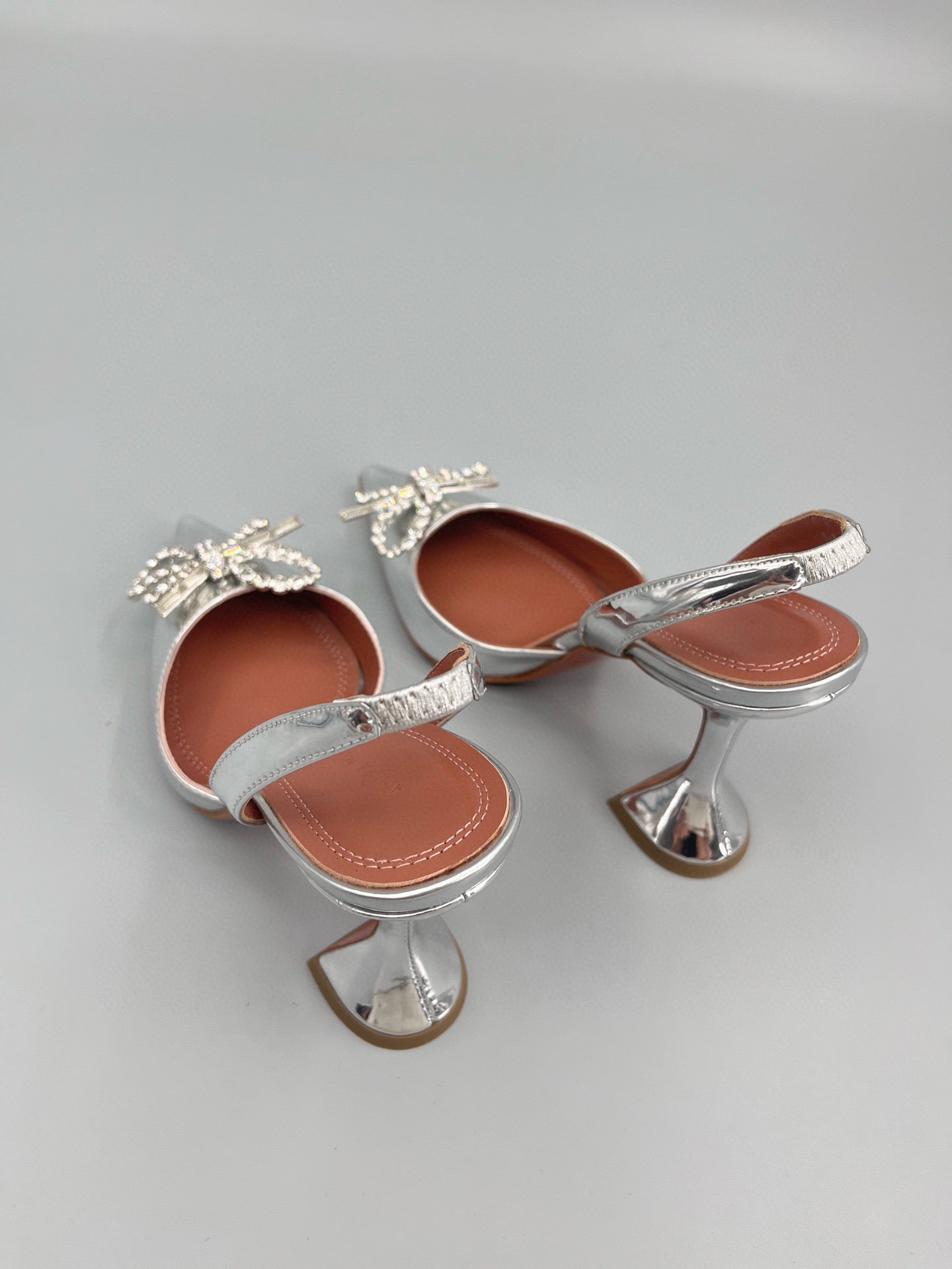 AMINA M HEELS