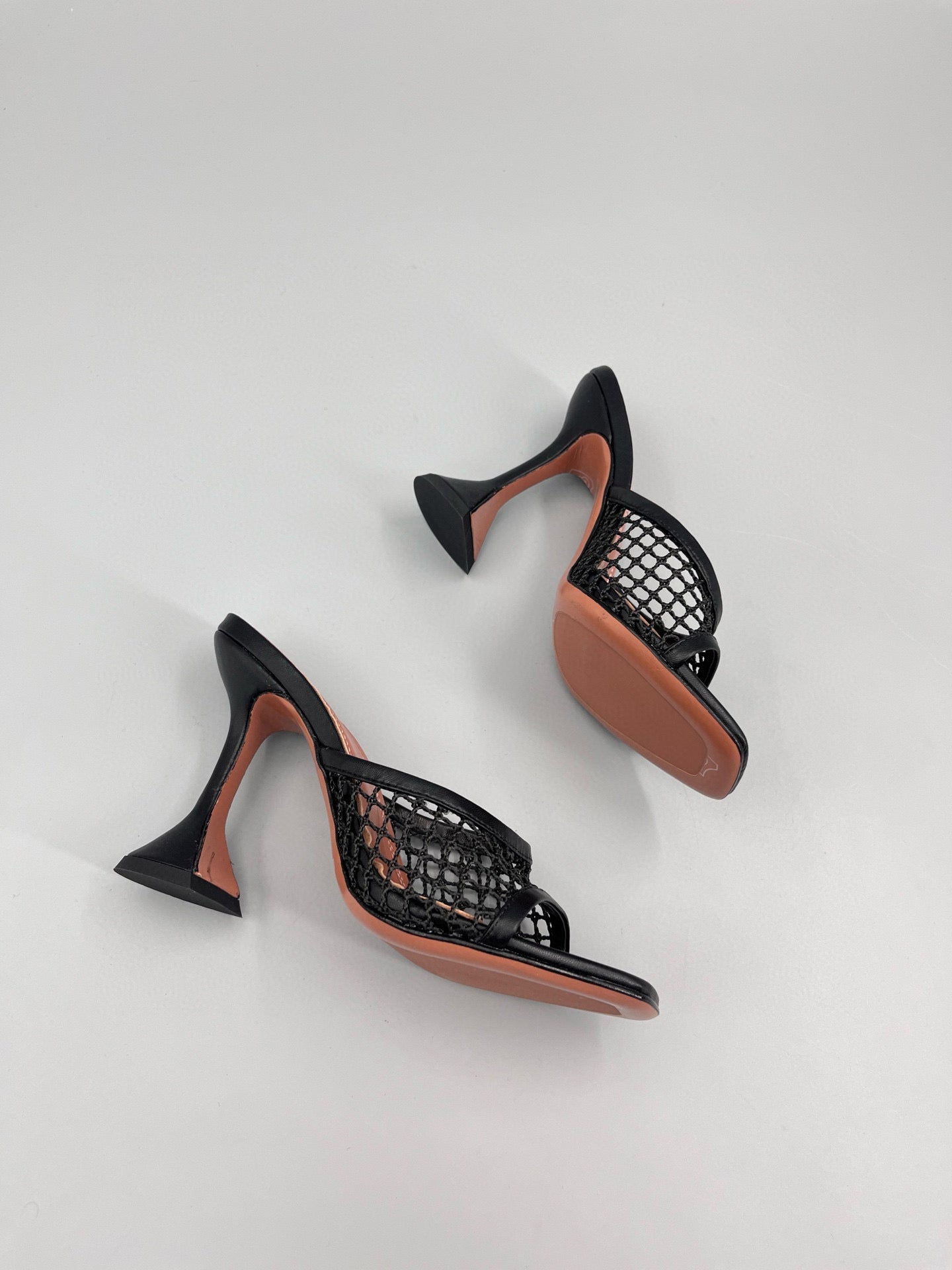 AMINA M HEELS