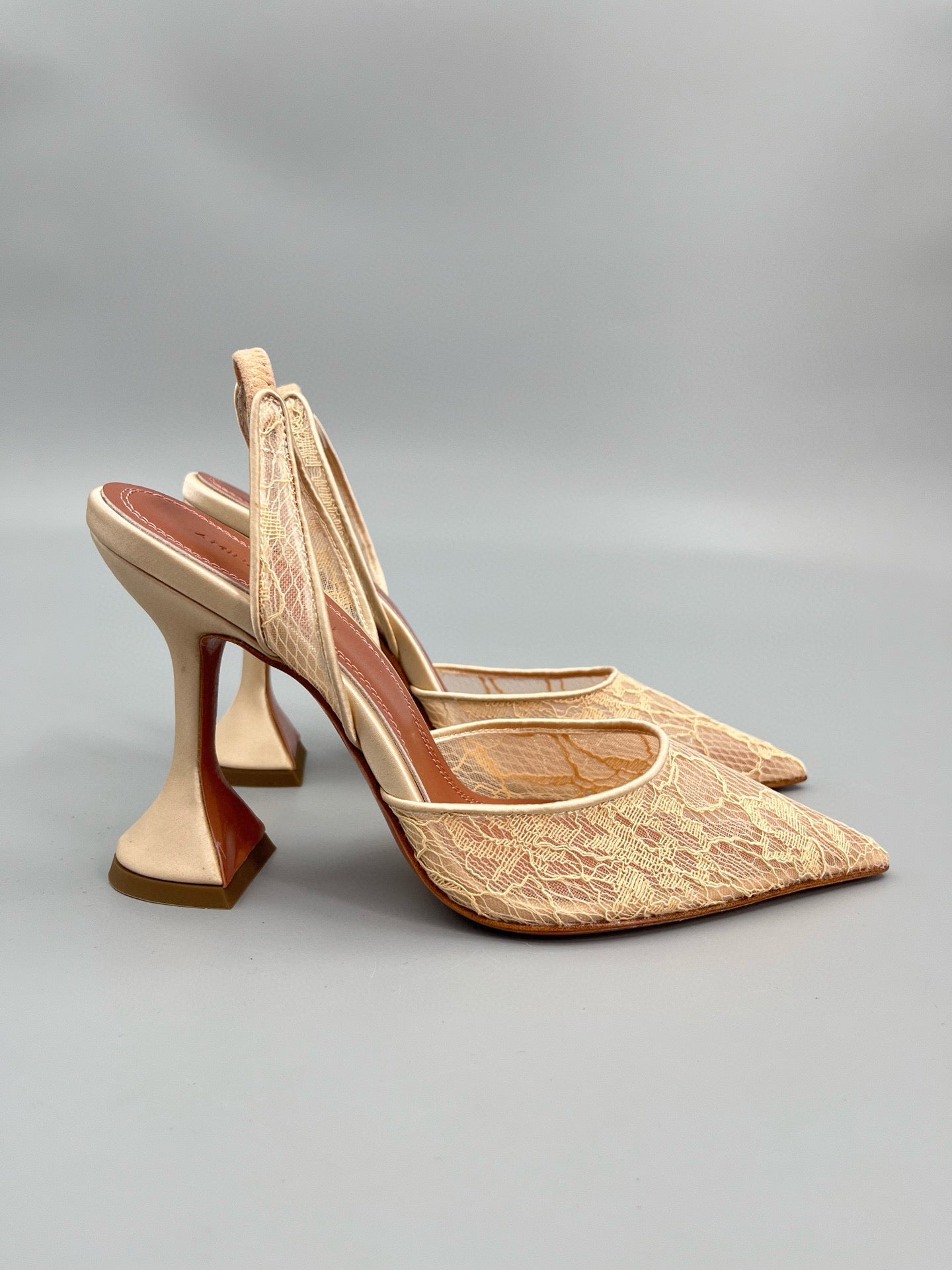 AMINA M HEELS
