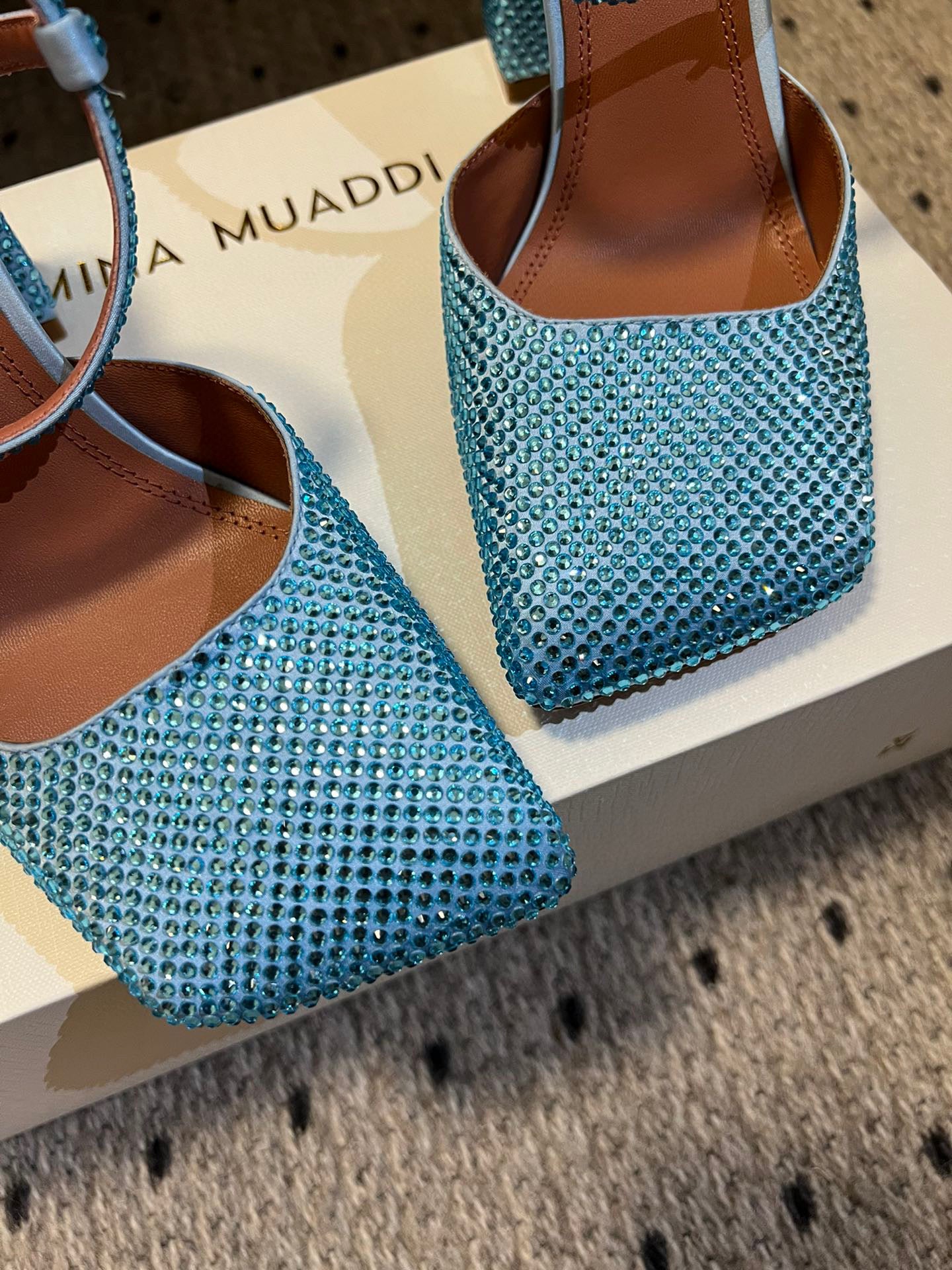 AMINA M HEELS