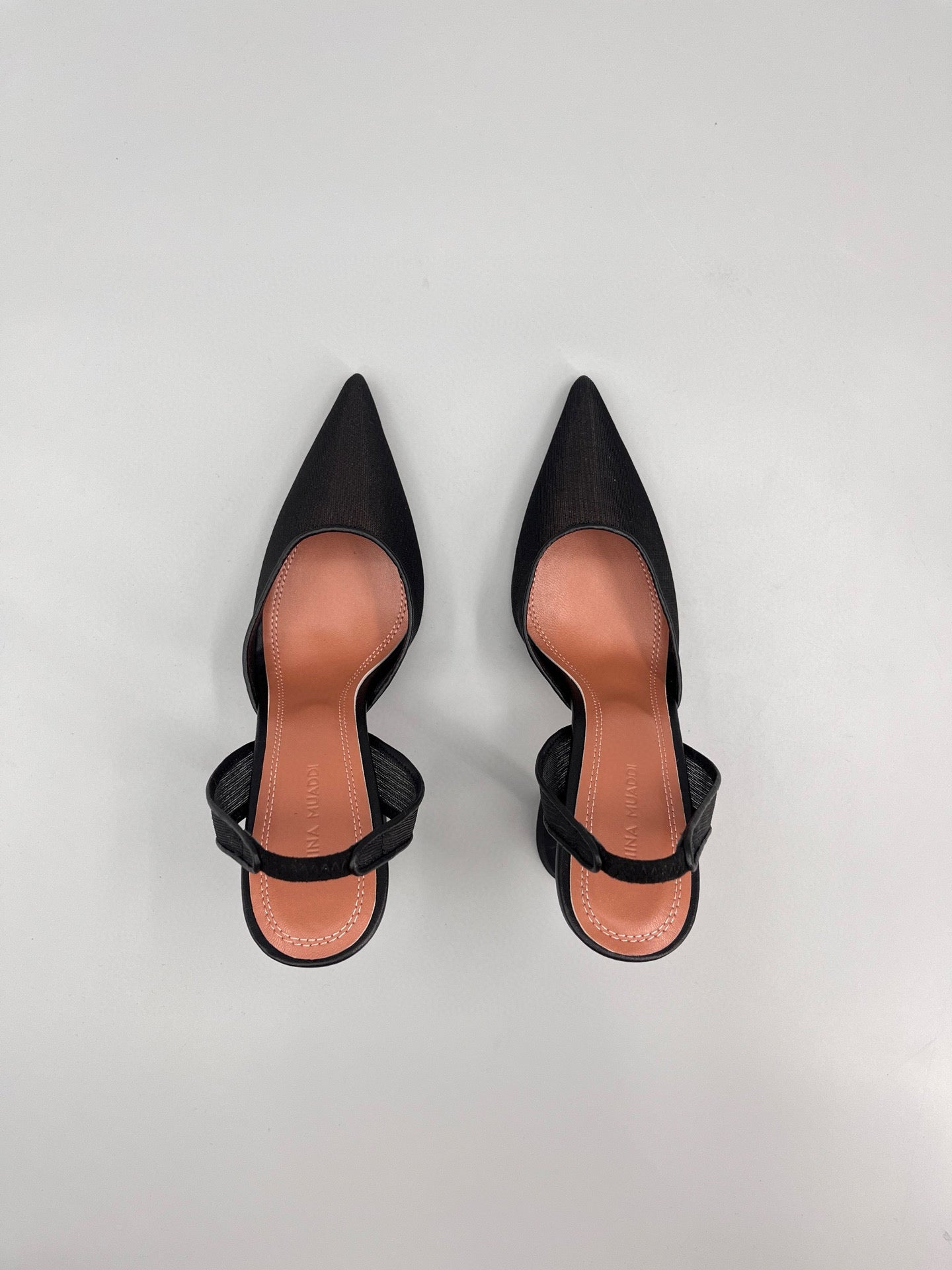 AMINA M HEELS