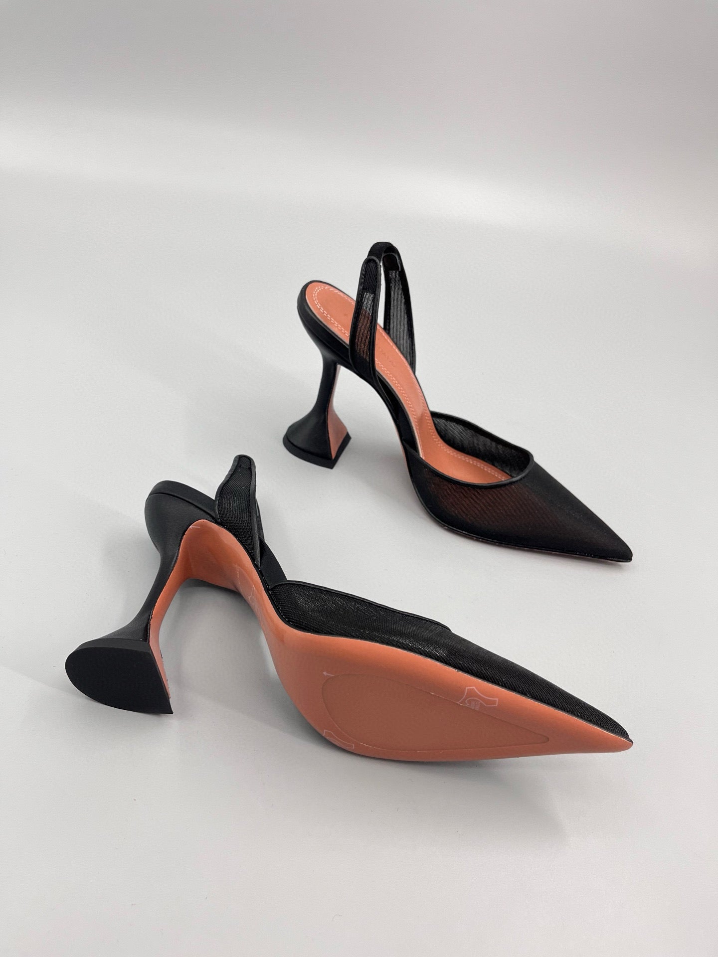 AMINA M HEELS