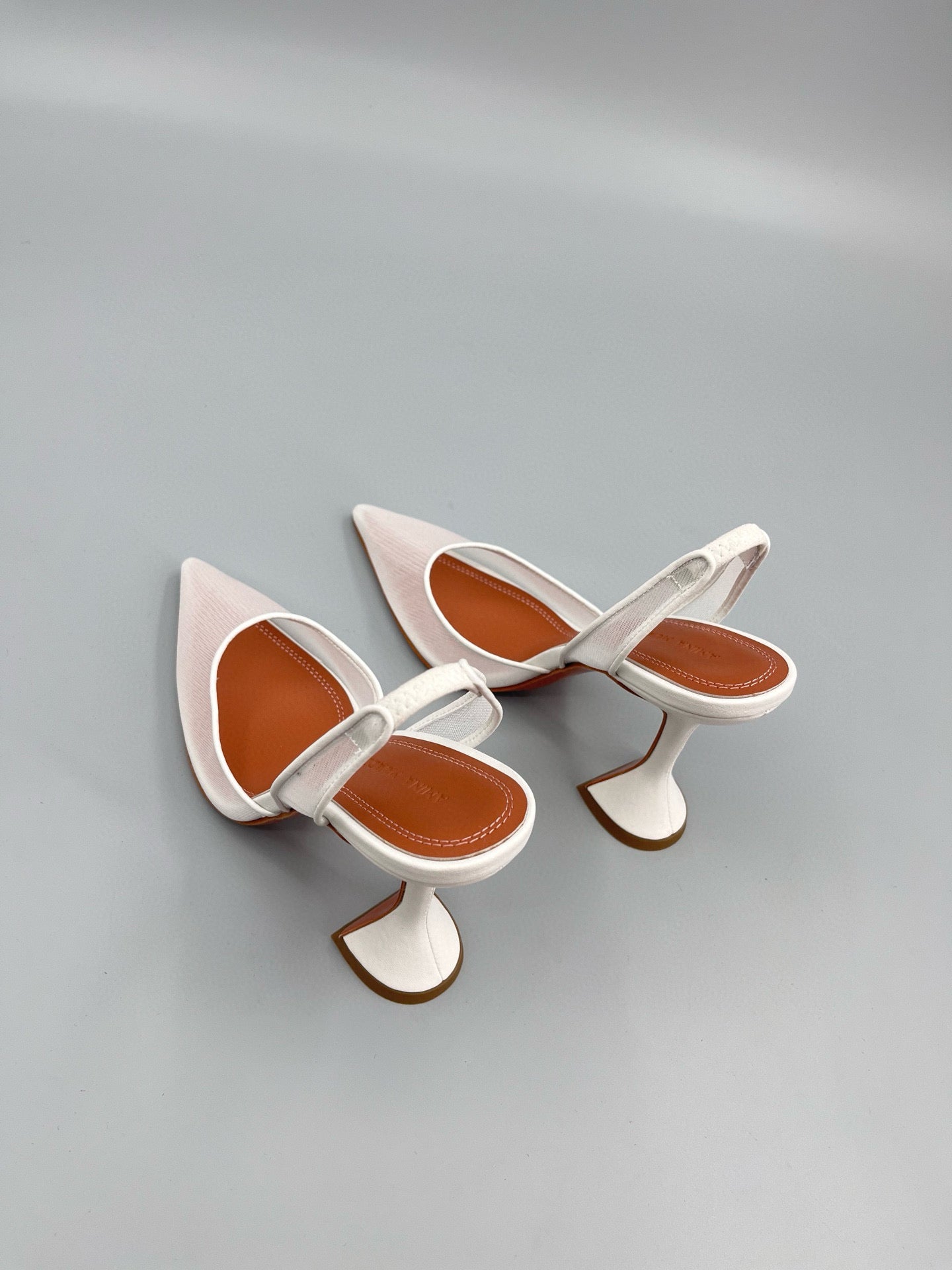 AMINA M HEELS