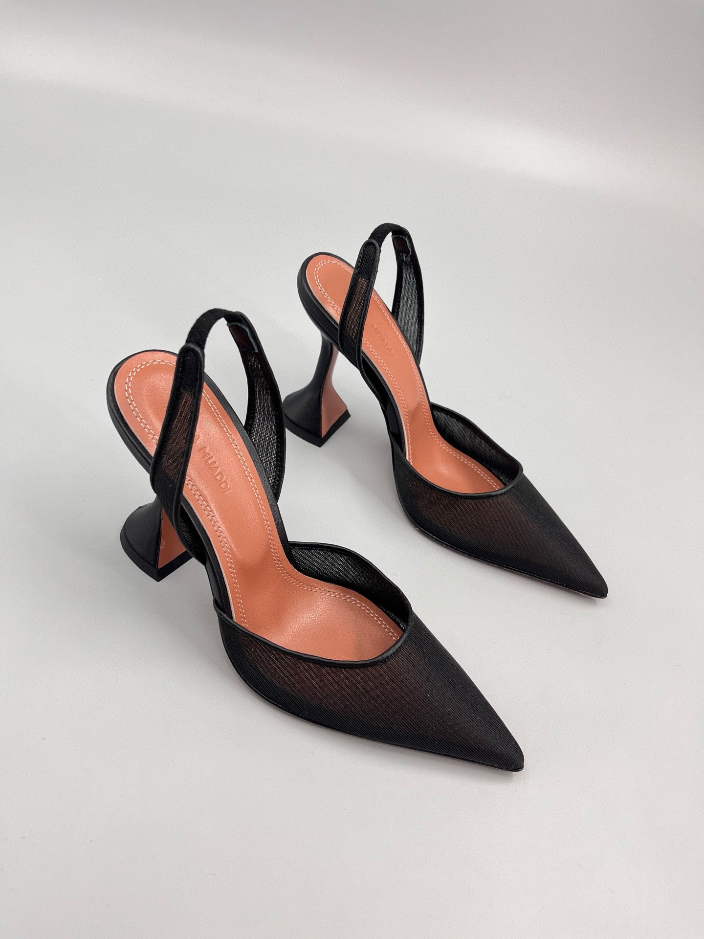 AMINA M HEELS