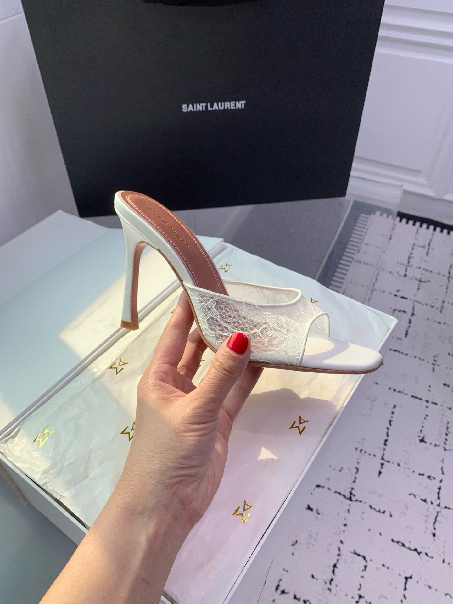 AMINA M HEELS