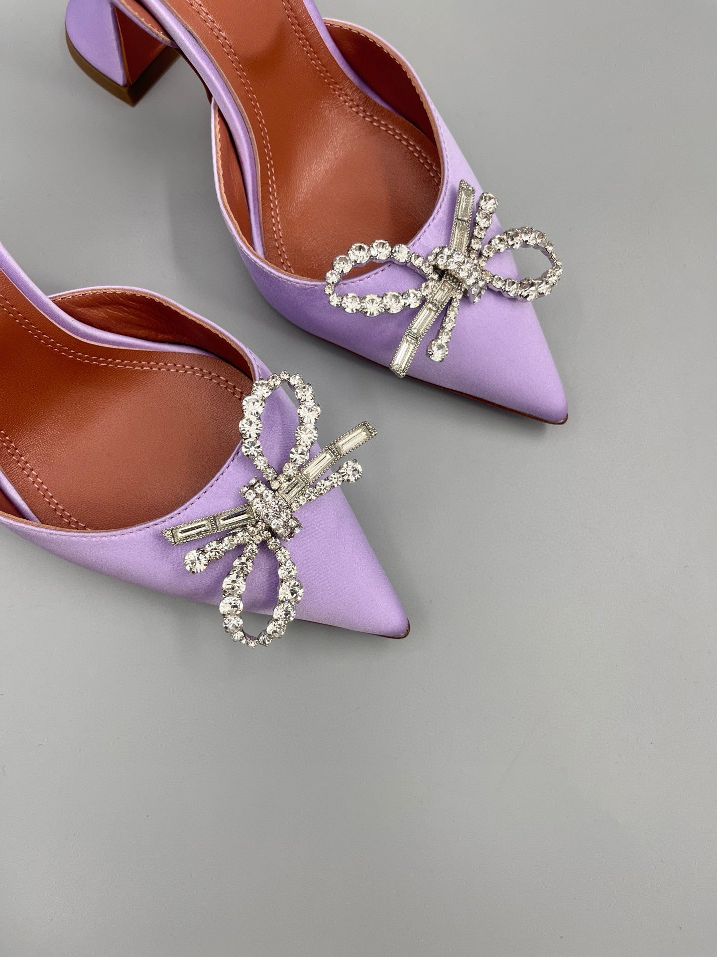 AMINA M HEELS