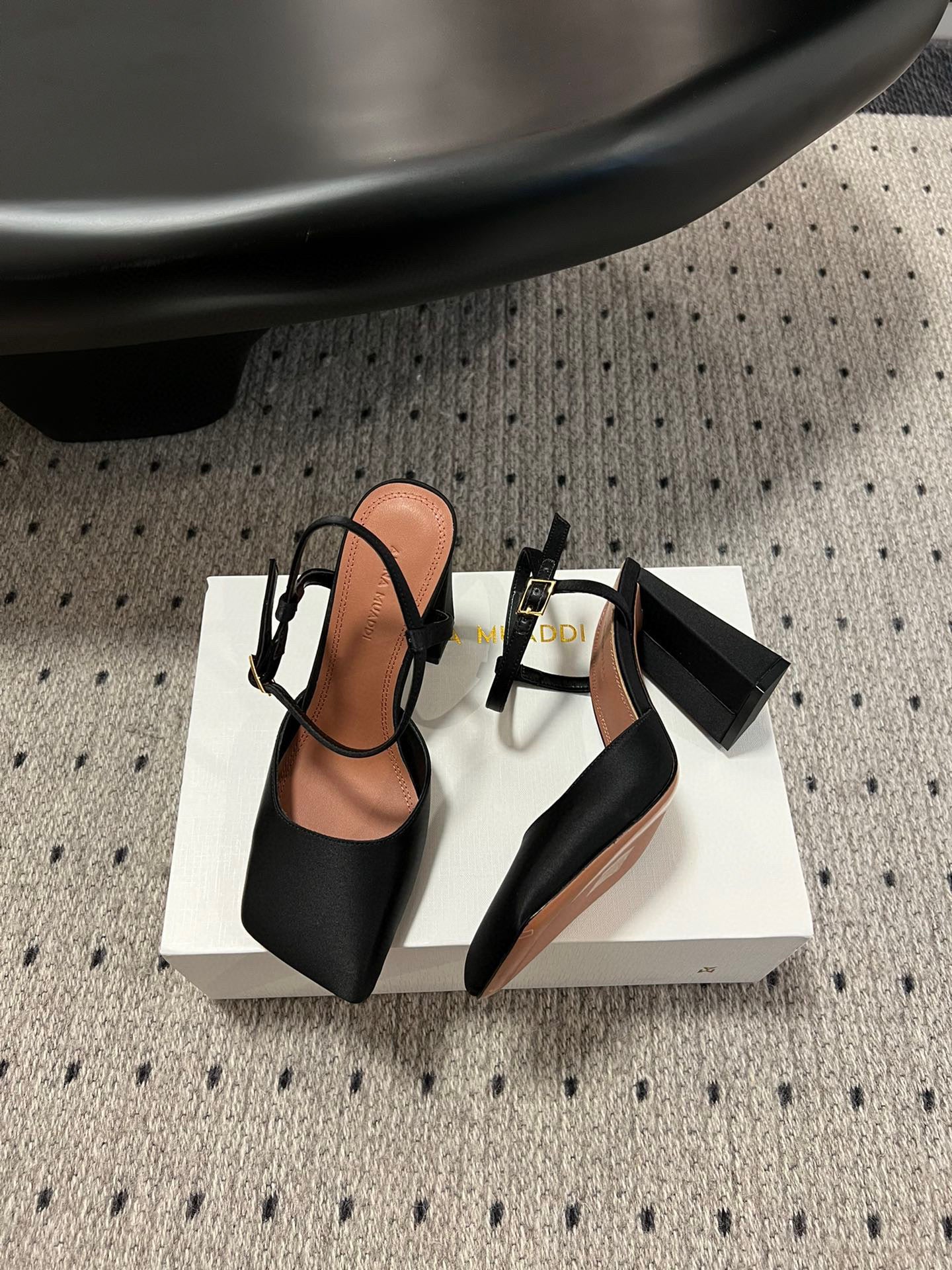 AMINA M HEELS