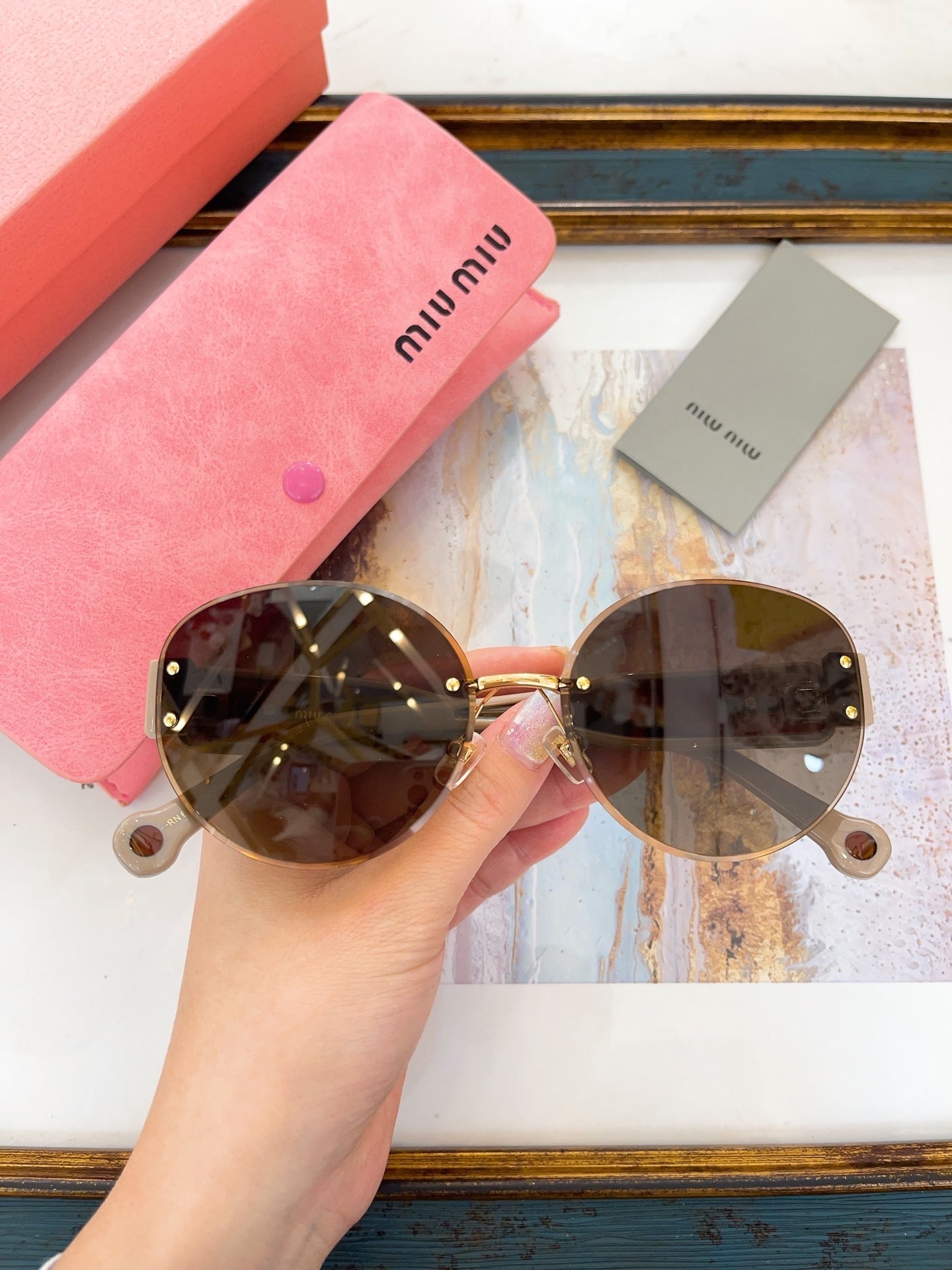 MIU M SUNGLASSES