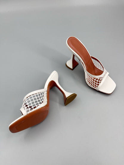 AMINA M HEELS