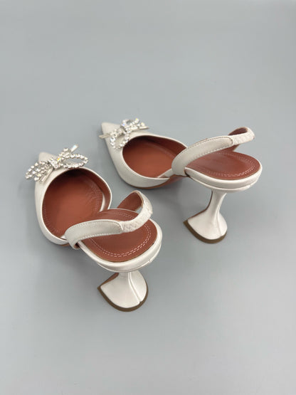 AMINA M HEELS